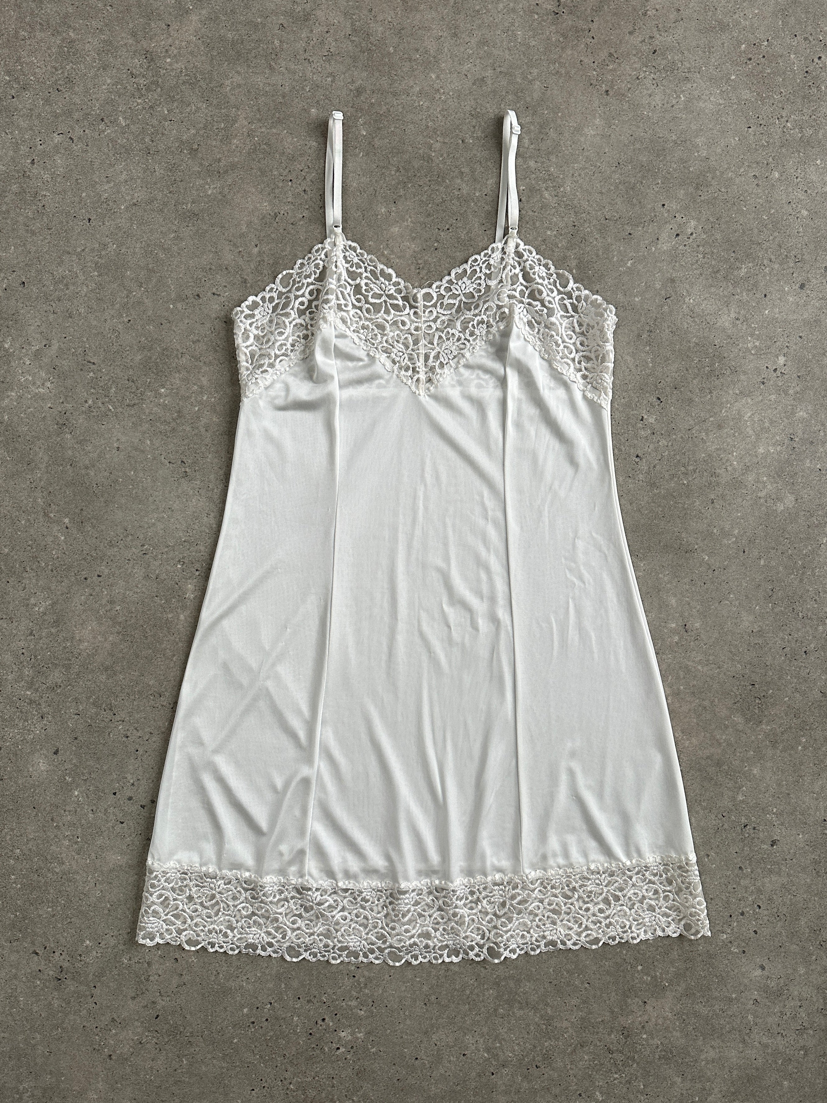 Japanese vintage 1990s lace sheer mini slip dress, size small, featuring delicate lace fabric and a classic vintage silhouette.