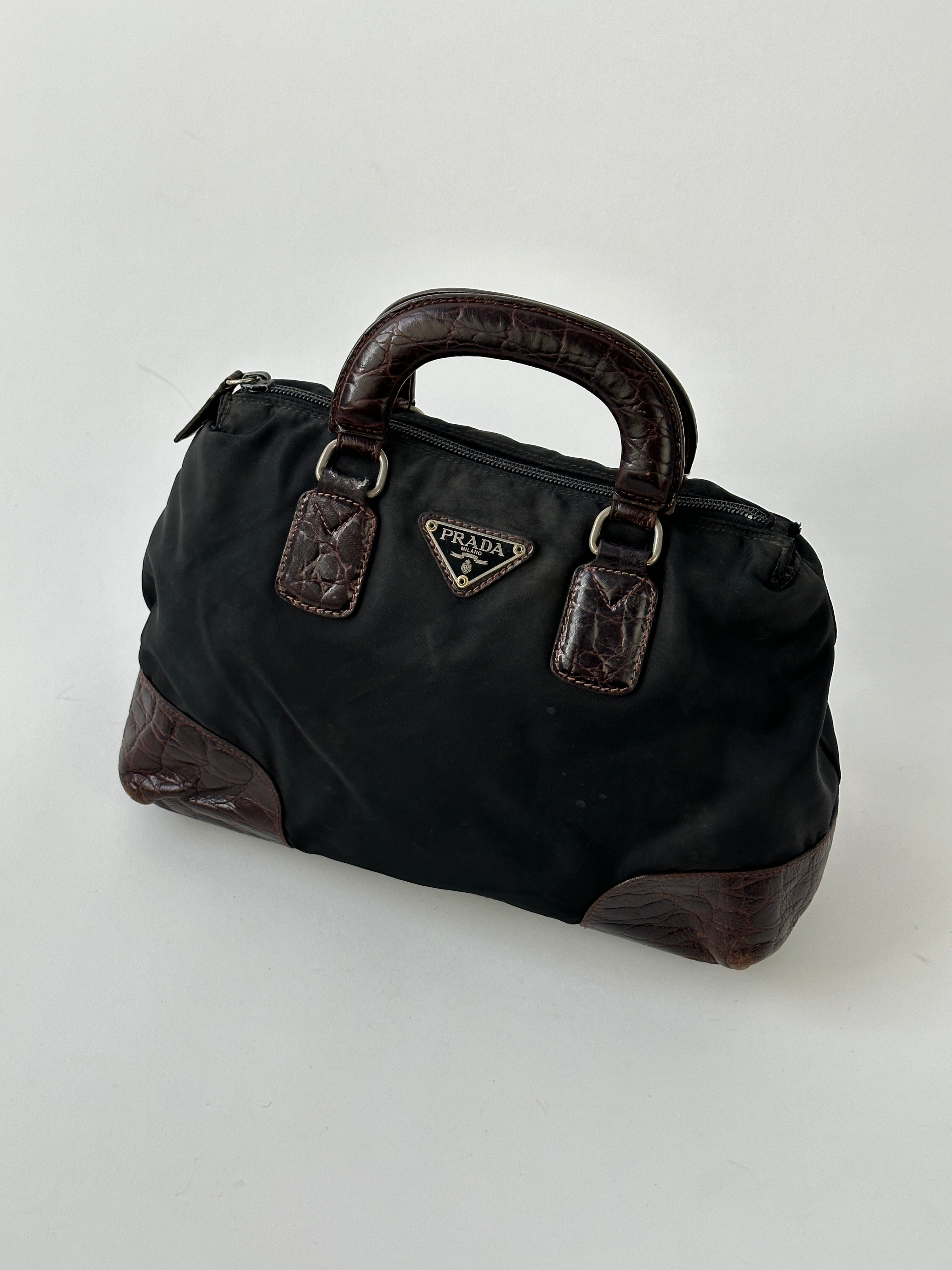 Prada nylon croc handbag with sleek design, featuring textured crocodile pattern and sturdy shoulder strap.