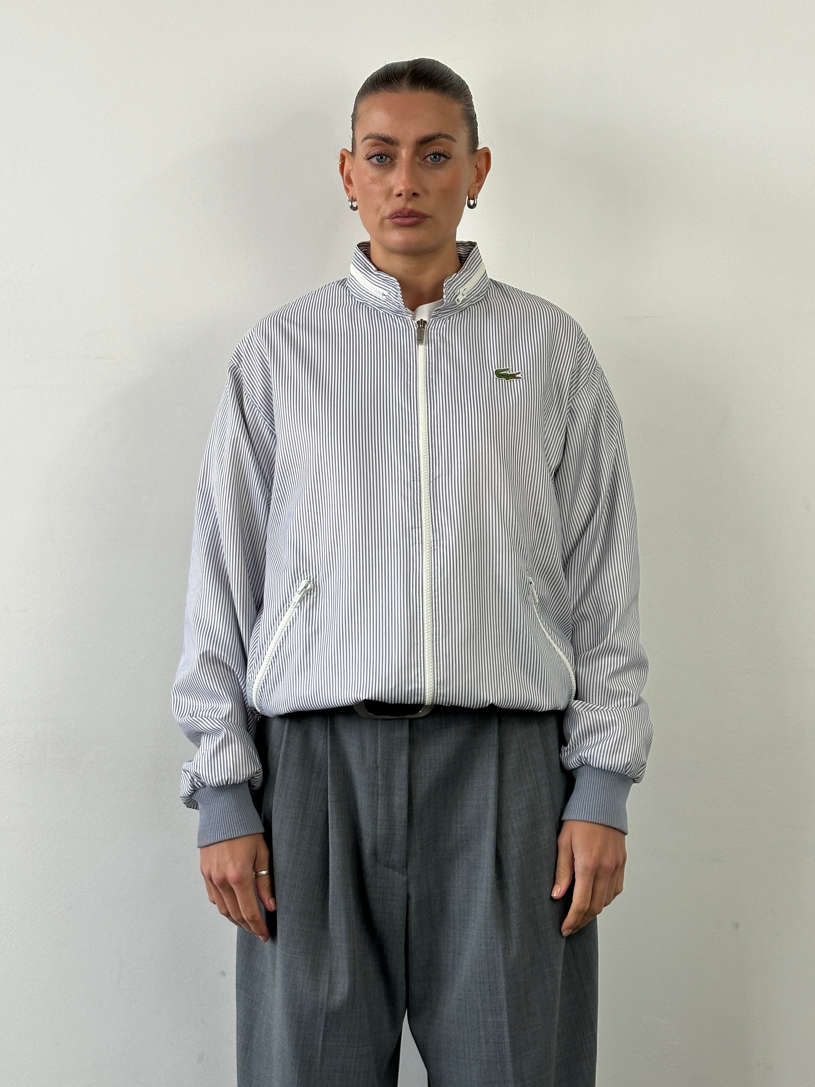 Lacoste 80s Stripe Tracksuit Jacket in size L, featuring classic striped design and logo details, casual athletic style.