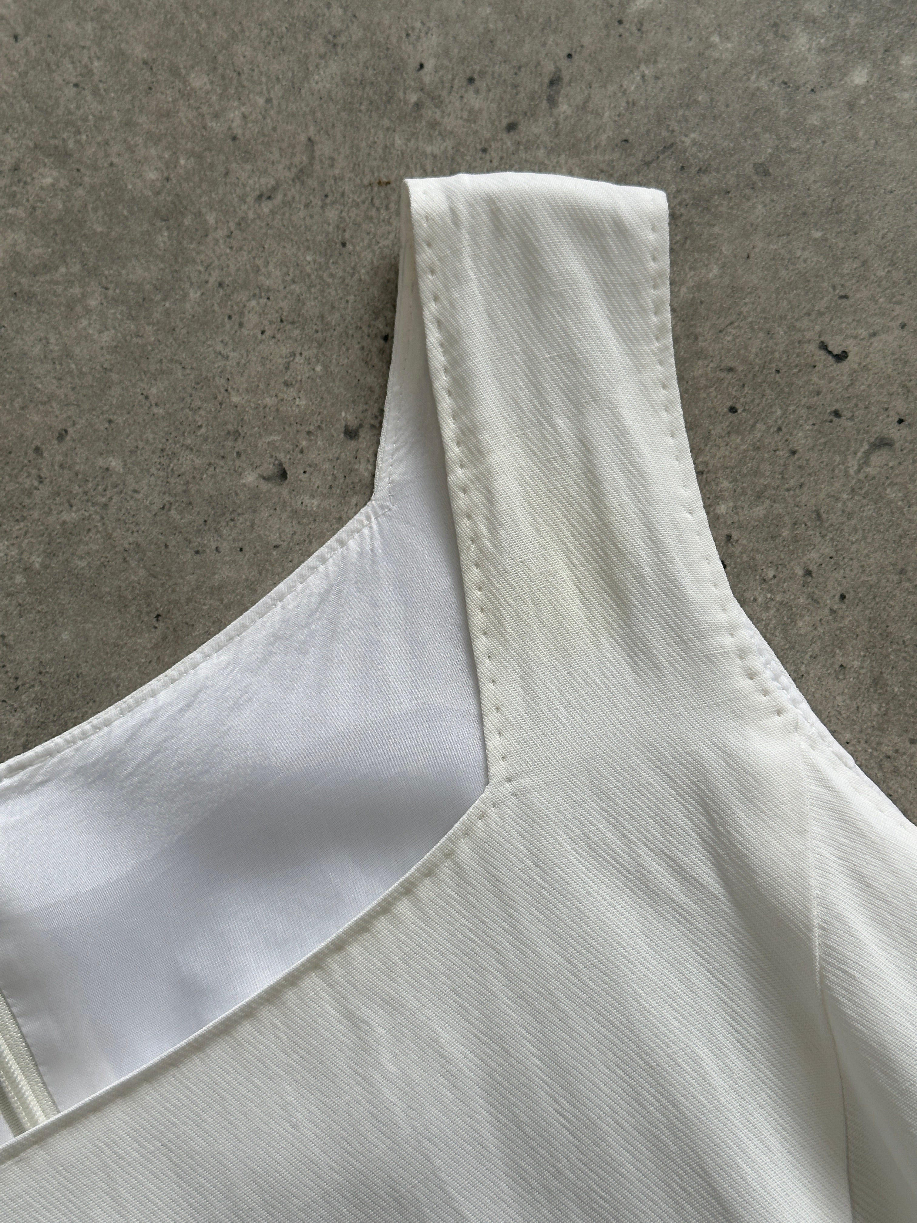 Max Mara linen square neck midi dress in M/L displayed on a hanger, showcasing its elegant design and lightweight fabric.