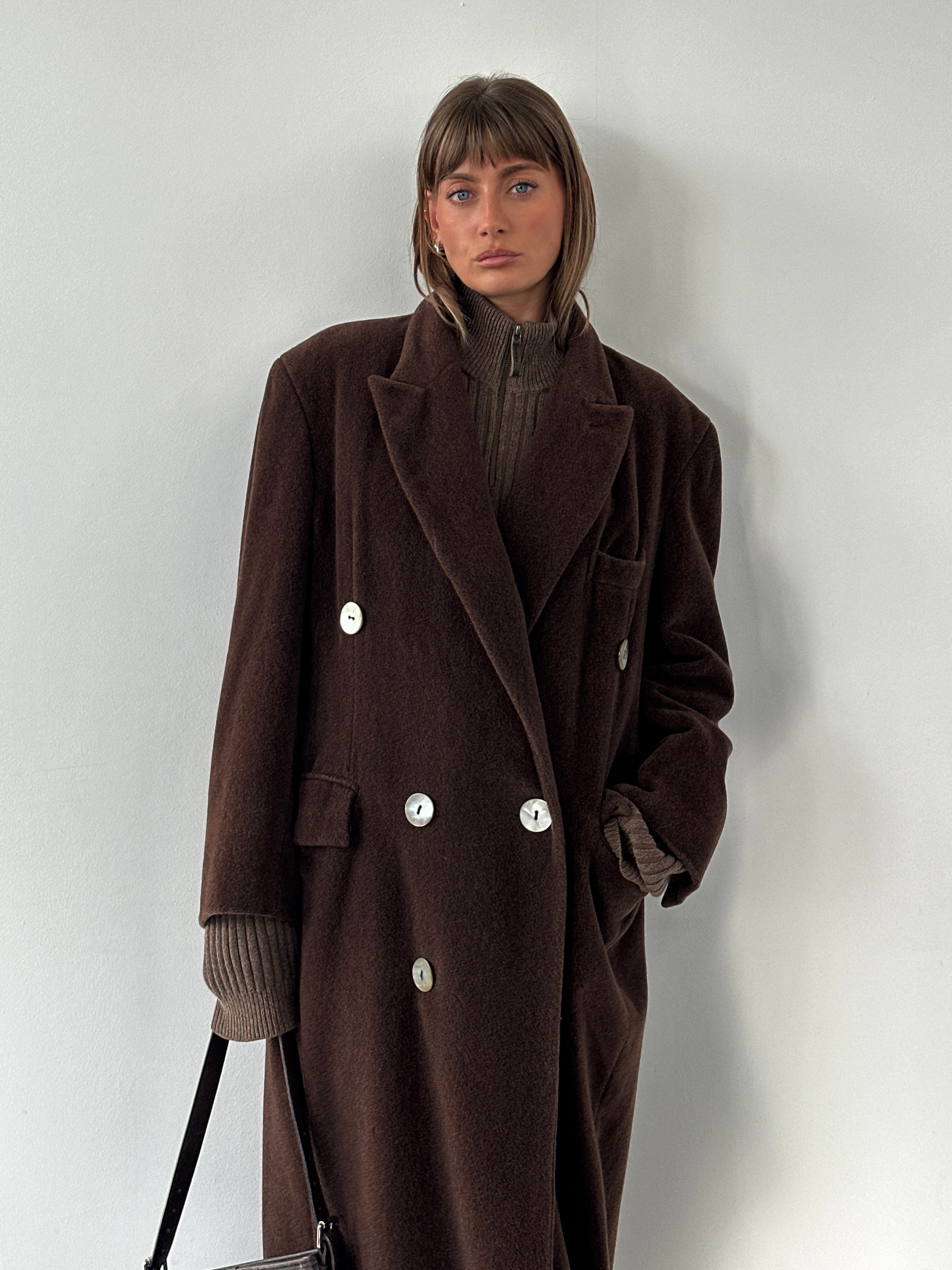 Moschino 1980s wool cashmere double-breasted coat in XL, shown on a hanger with classic tailored design and rich fabric texture.