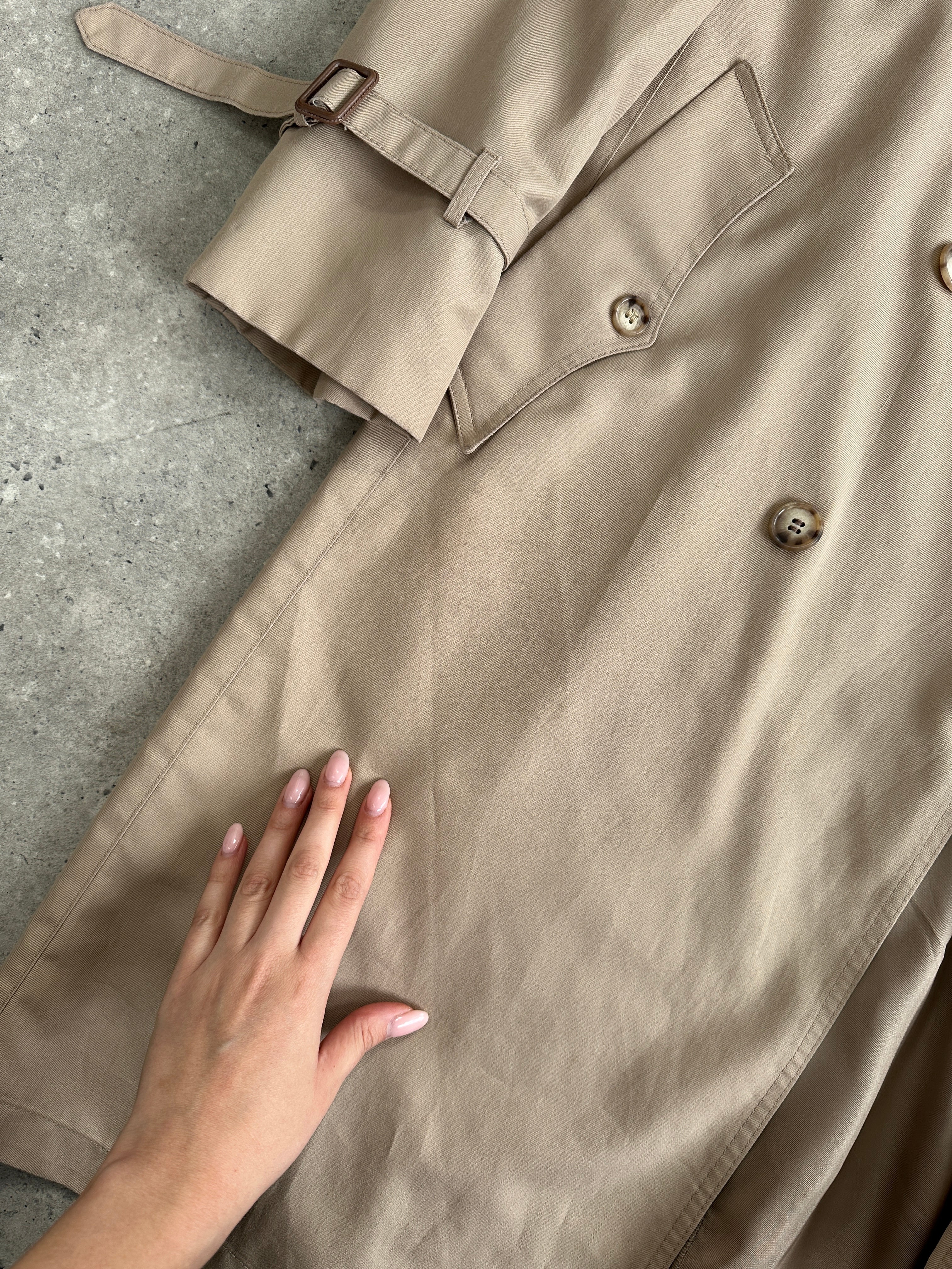 Christian Dior Monsieur double-breasted belted trench coat in size L/XL, shown in a stylish beige fabric with classic design details.