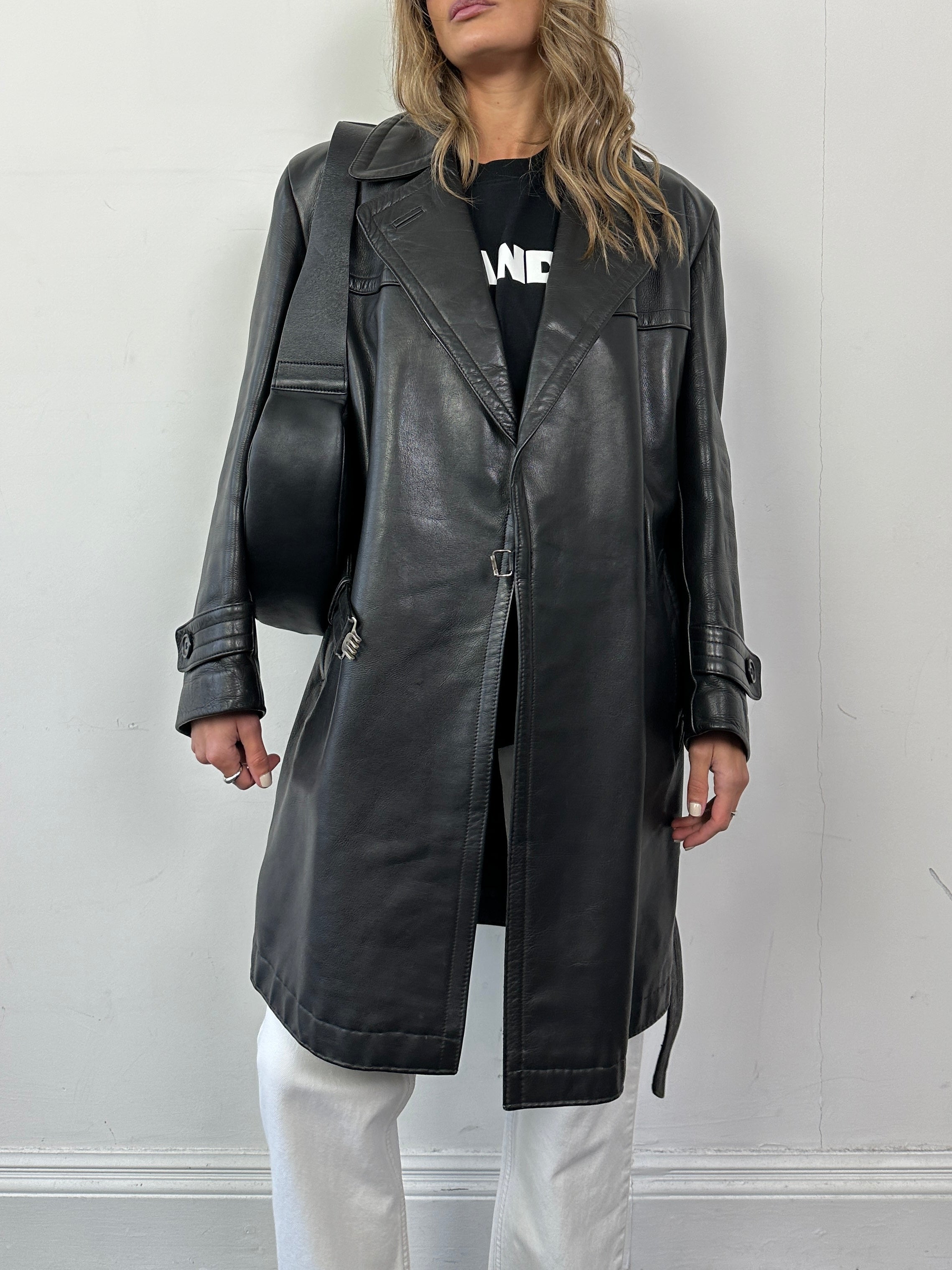 Vintage leather belted trench coat jacket in size L, featuring classic design and stylish details.