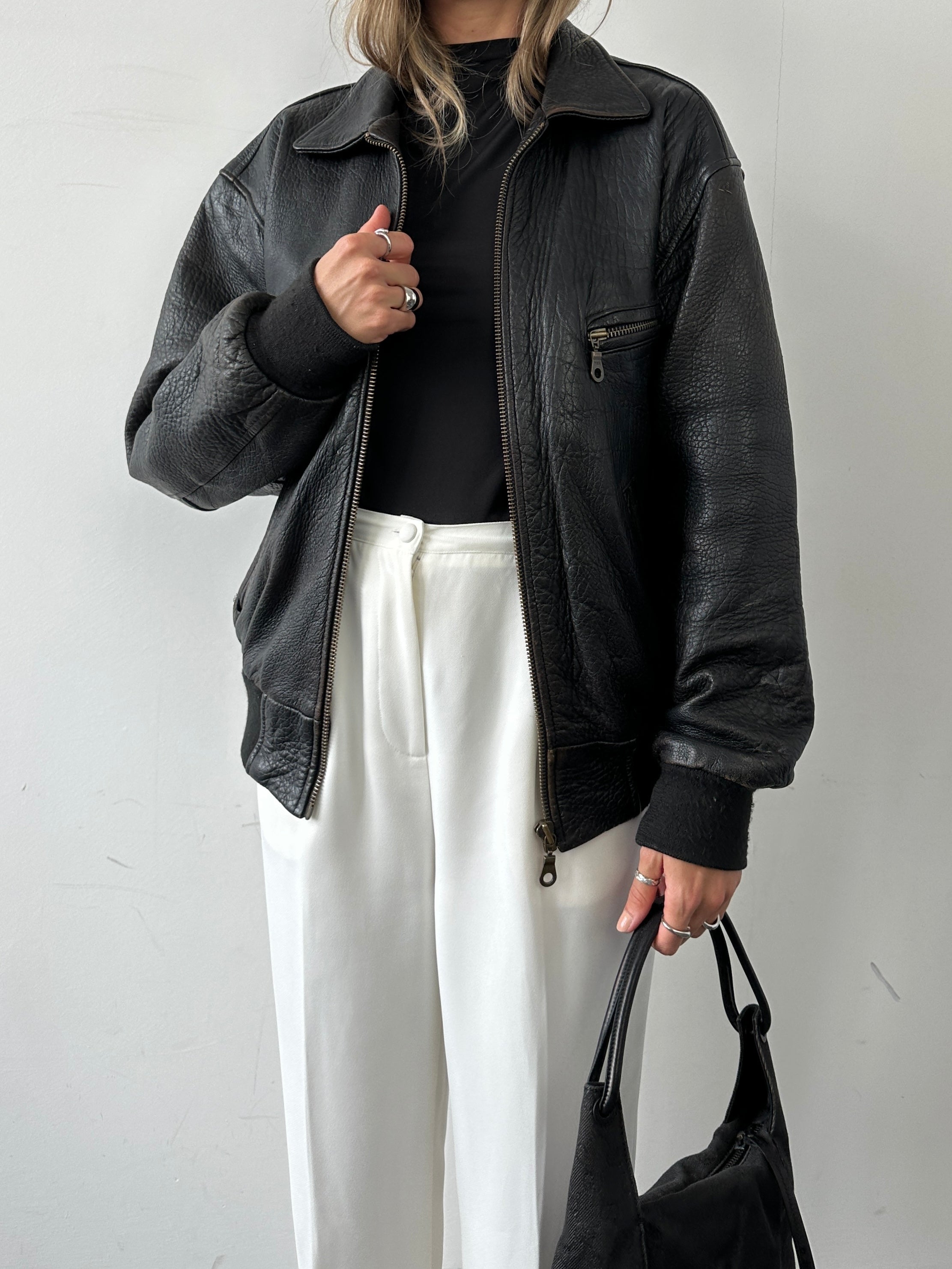 Vintage British vintage leather bomber jacket in size M, showcasing classic style and durable leather construction.