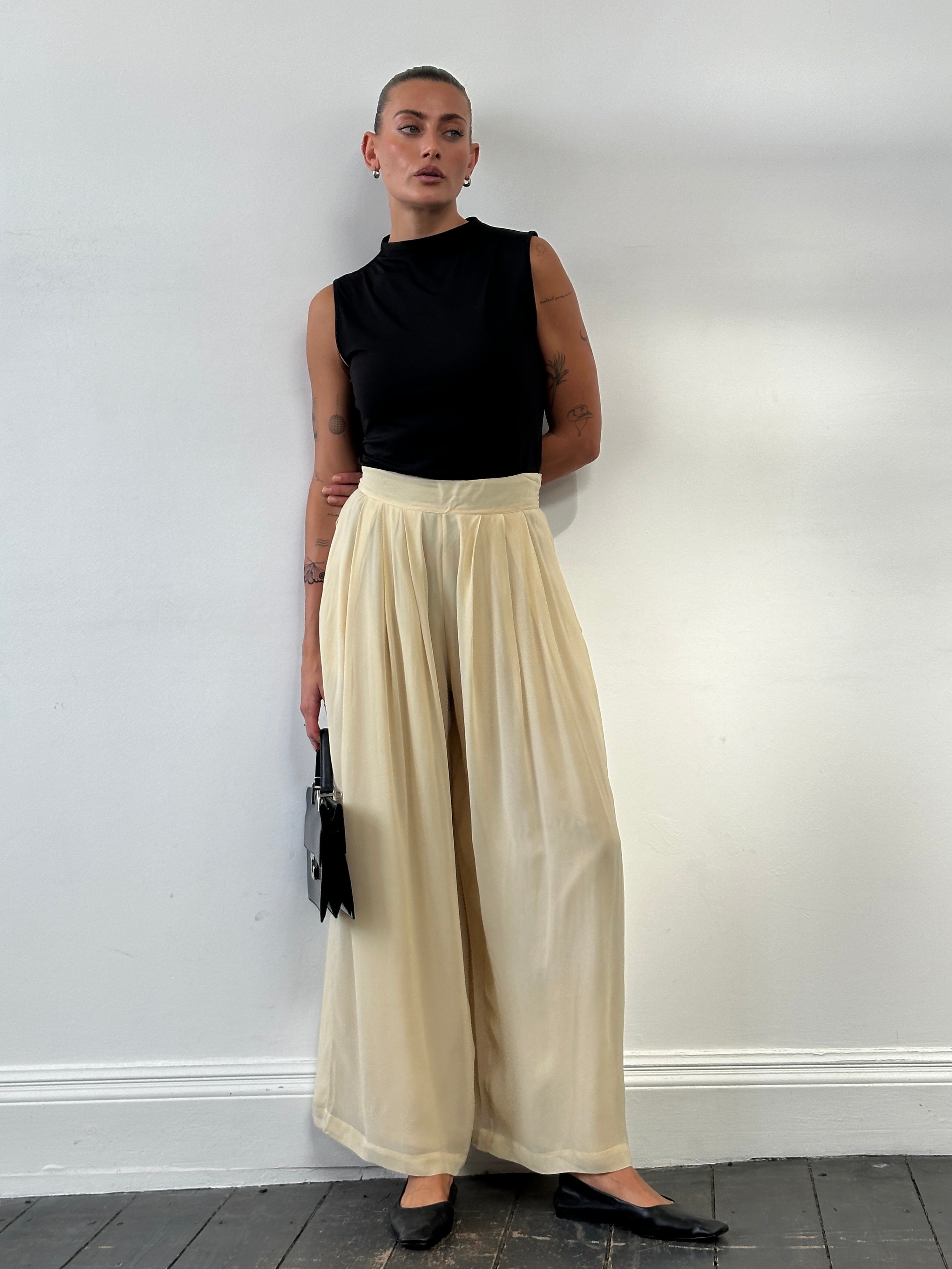 Marella wide-leg high-waisted tailored palazzo trousers in beige, front view showing relaxed fit and wide waistband.