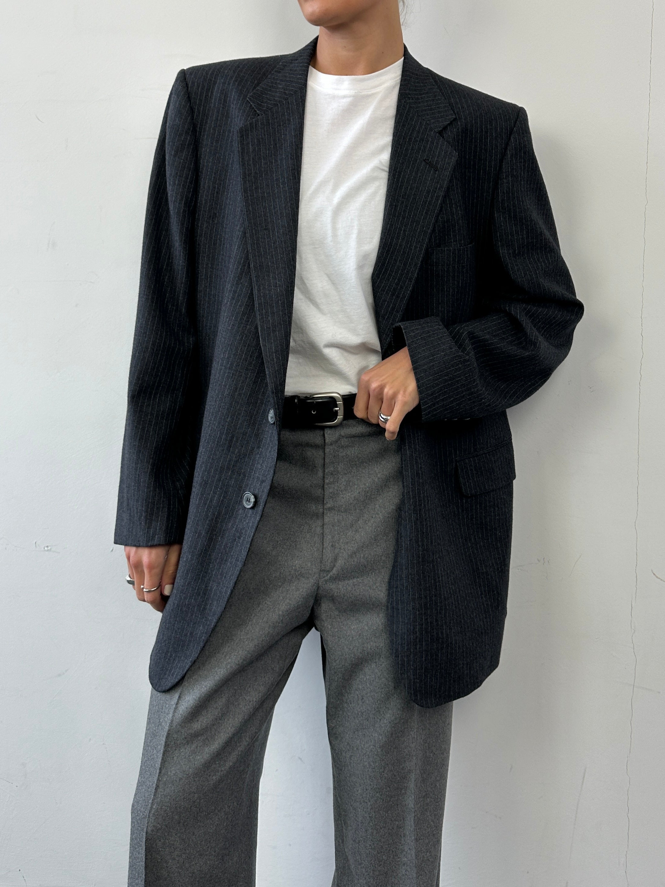 Givenchy pinstripe pure wool blazer in size L/XL, single-breasted with lapels and tailored fit, displayed on a hanger.