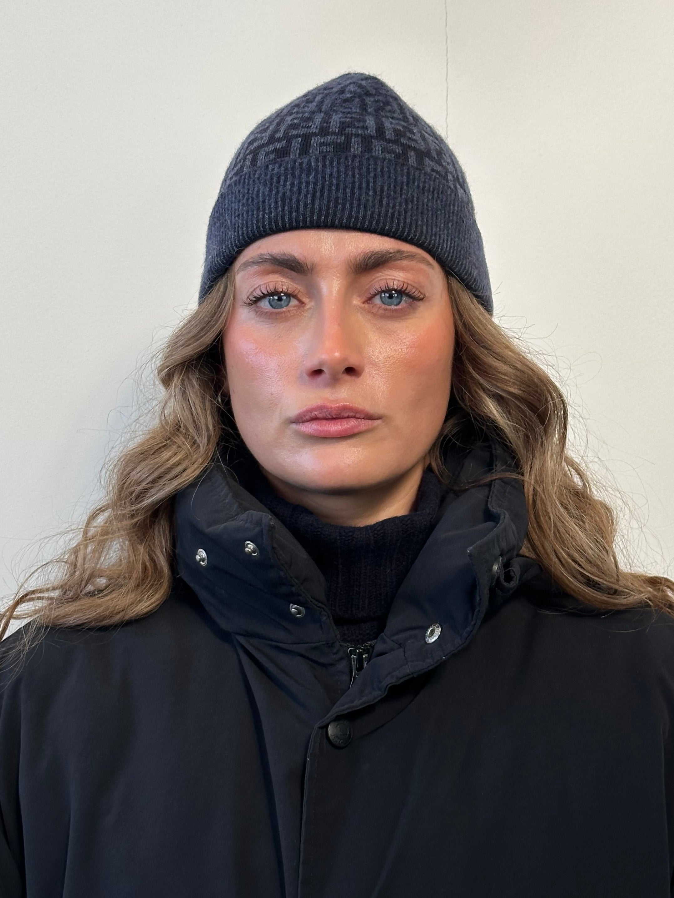 Fendi FF monogram print beanie hat with ribbed knit fabric and folded cuff, stylish and warm accessory.
