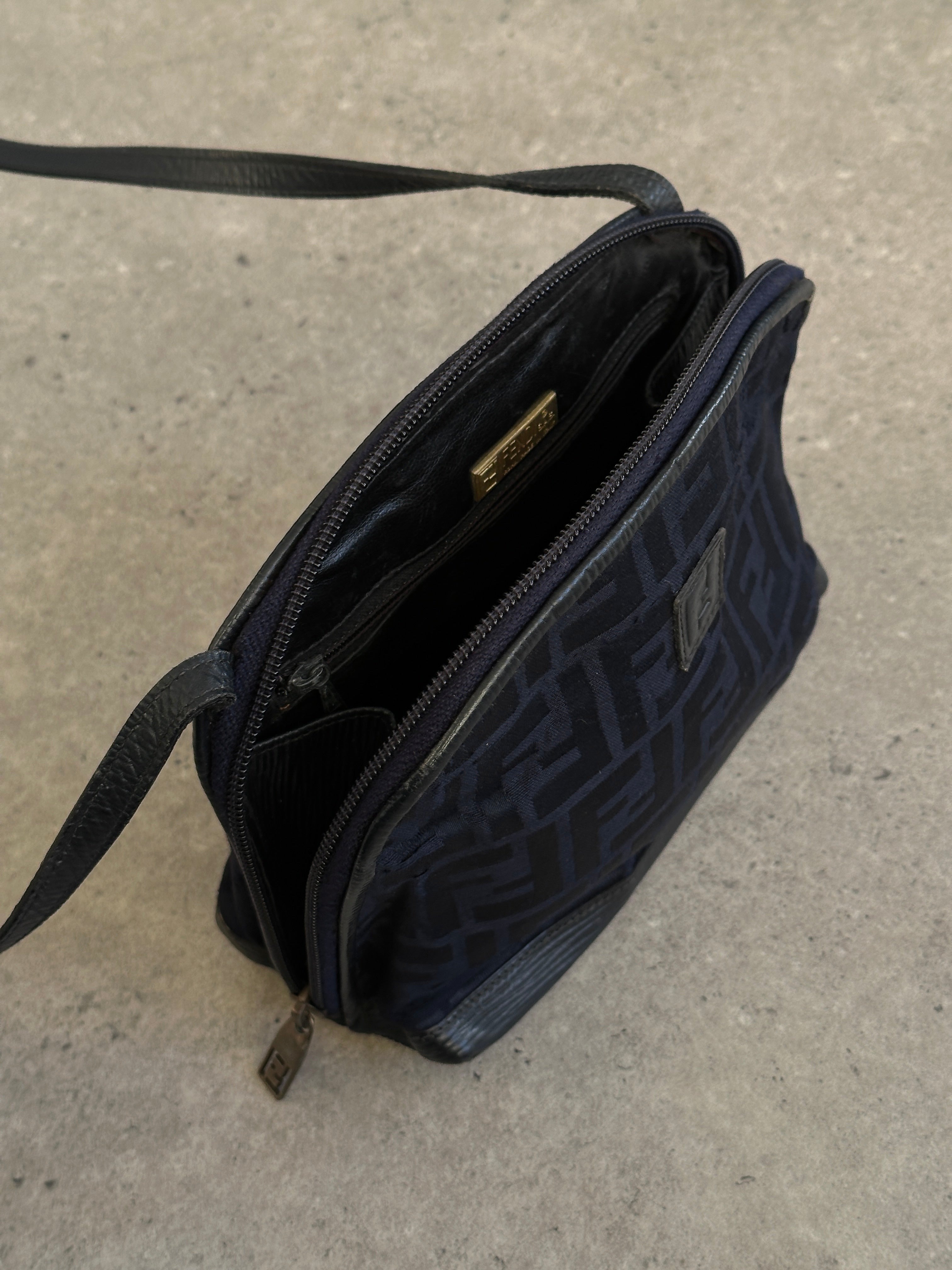 Fendi FF Monogram Crossbody Bag with adjustable strap and signature logo pattern, stylish and compact for everyday use.