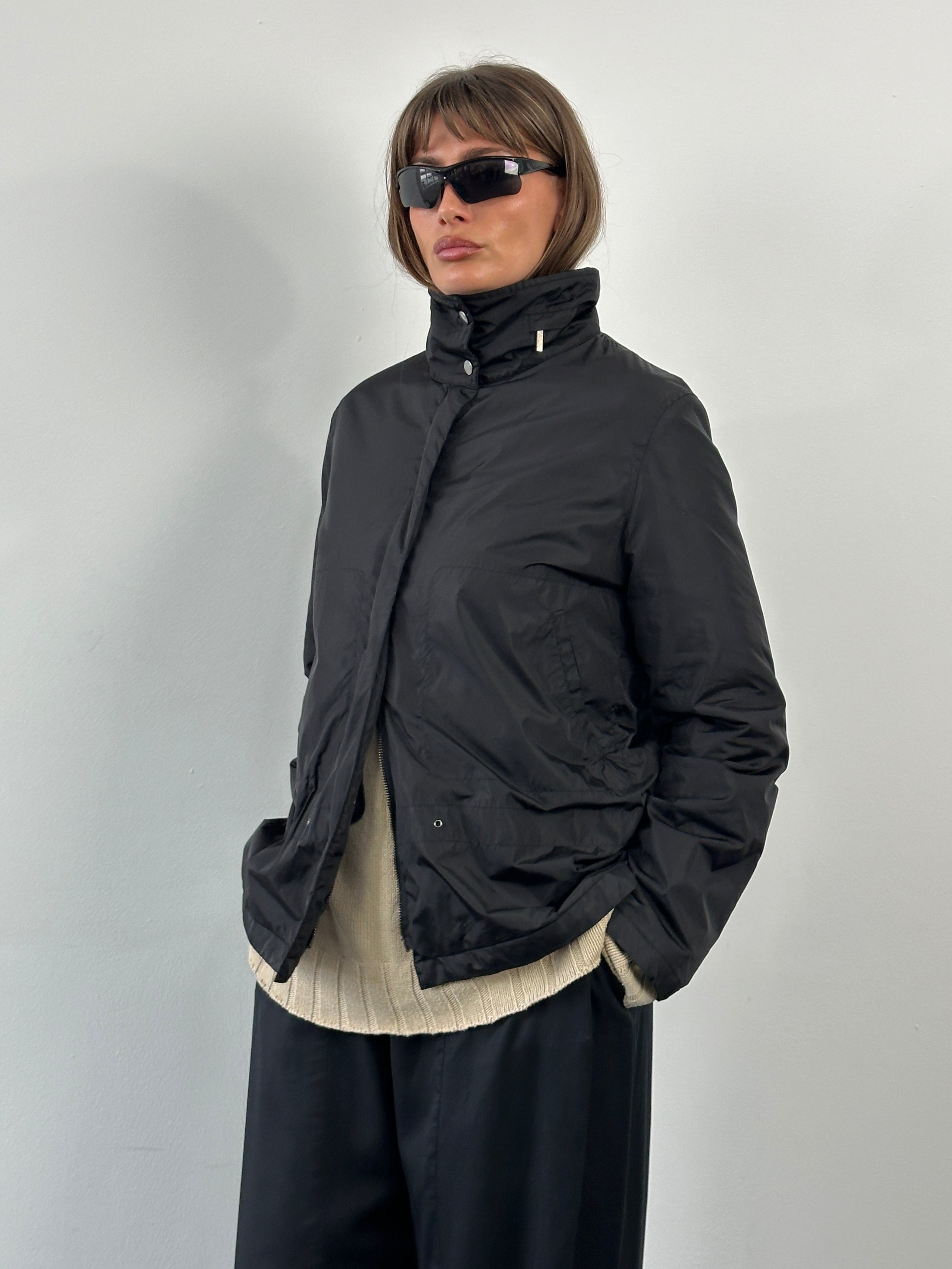 Burberry London 2000s nylon high neck jacket in black, front view showing high collar and sleek design.