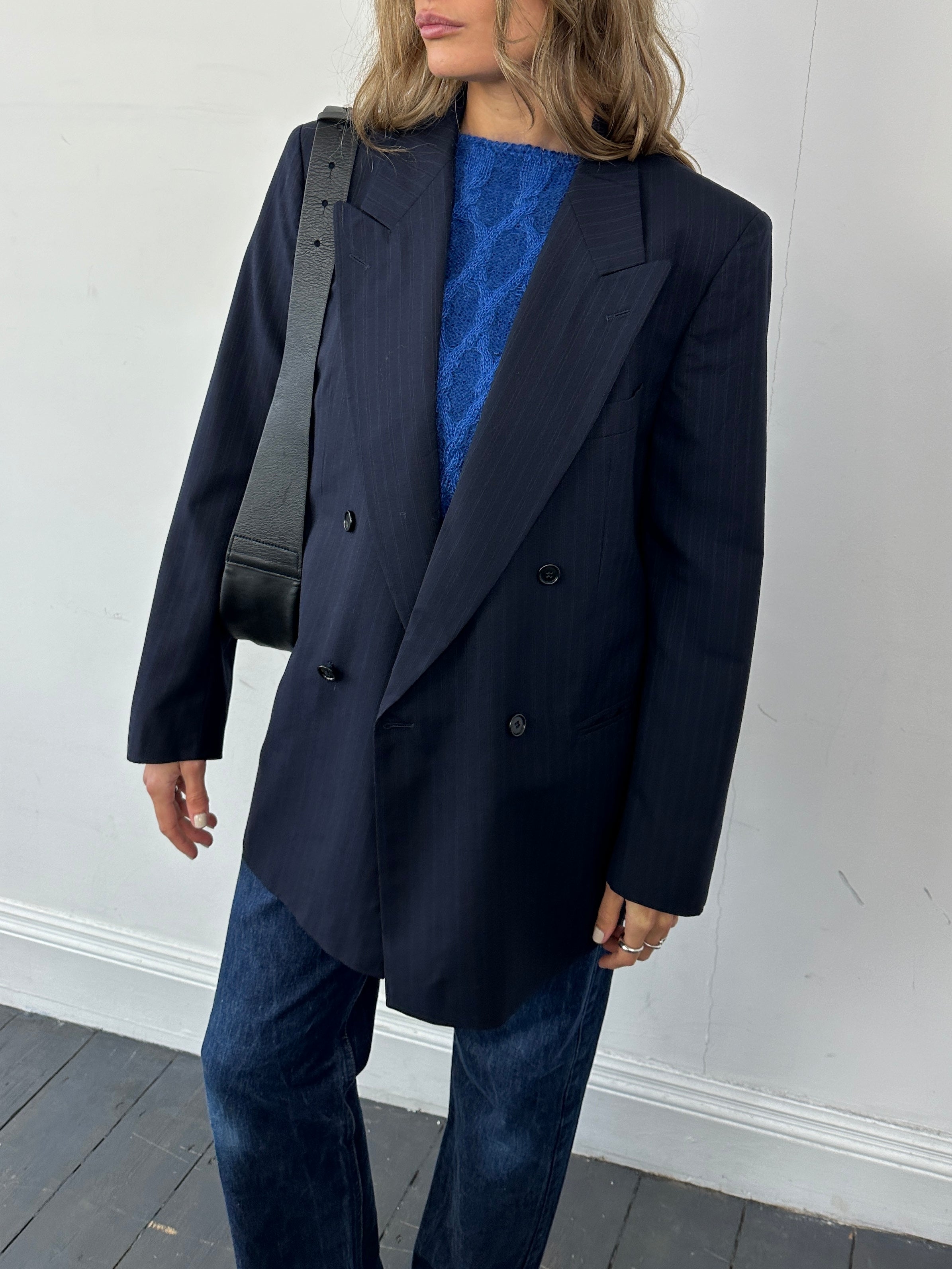 Hugo Boss pinstripe pure wool double-breasted blazer in size L, tailored fit with notch lapels and front buttons.