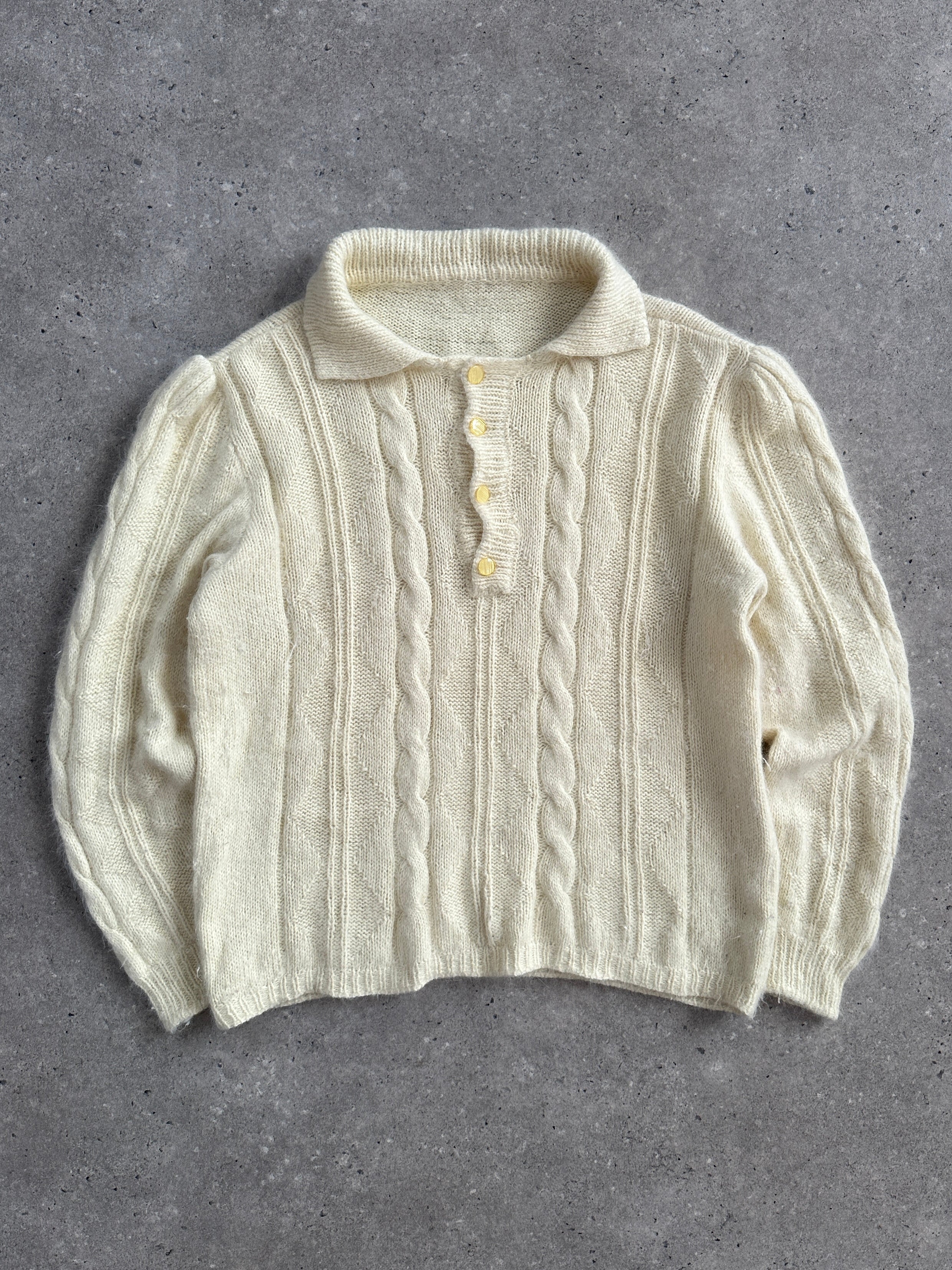 Vintage 1980s mohair knitted polo jumper in size M, with classic collar and textured knit pattern, displayed on a plain background.