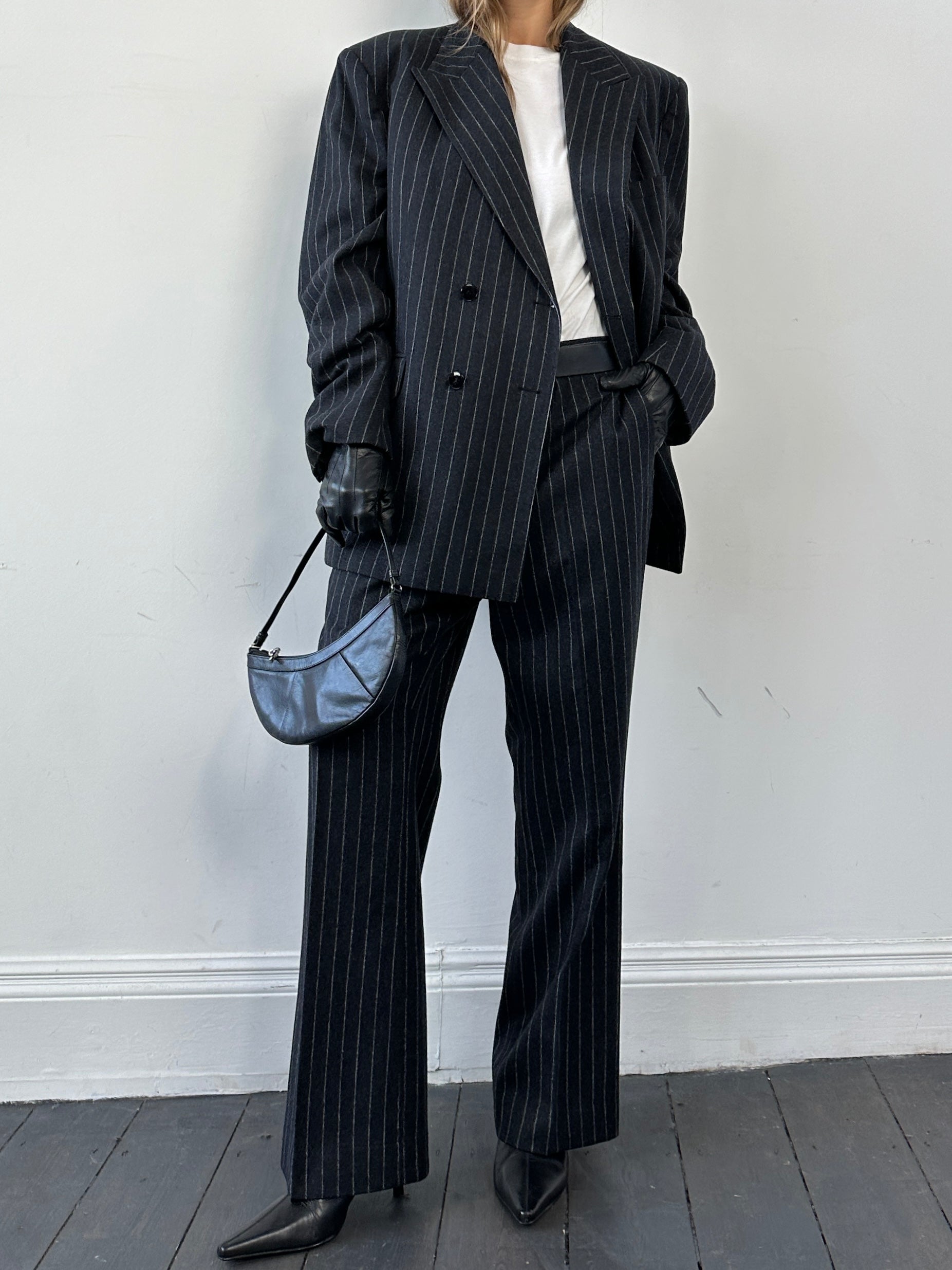 Christian Dior pure wool double-breasted pinstripe jumpsuit in size 45L/W32, featuring a tailored fit and classic pinstripe design.