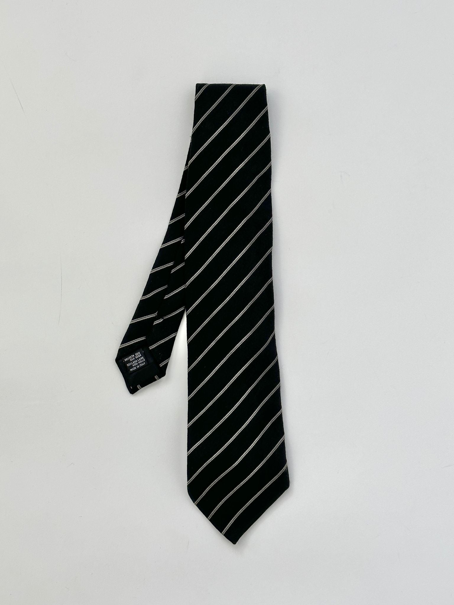 Giorgio Armani silk wool tie with diagonal stripe pattern in navy and gray, crafted for a sophisticated formal look.