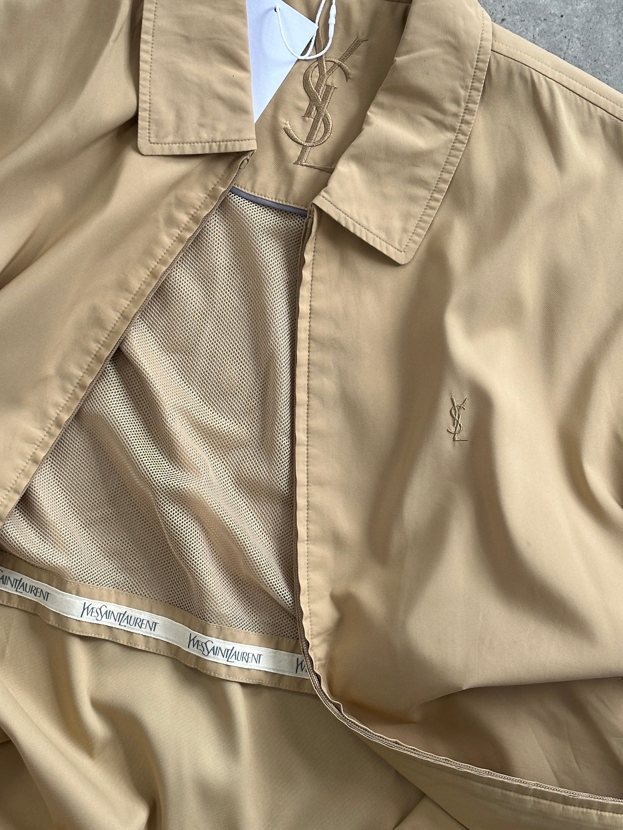 Yves Saint Laurent Pour Homme showerproof logo bomber jacket in size L, black with YSL branding and ribbed cuffs and hem.