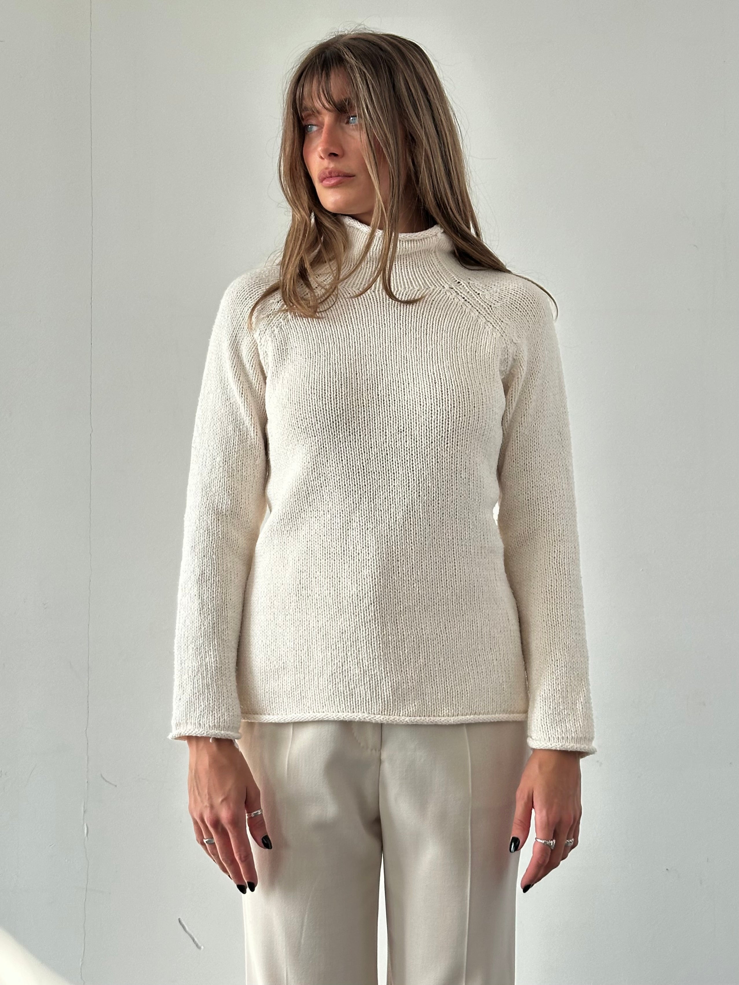 L.L.Bean pure cotton high neck jumper in size M, showcasing a cozy, cream-colored knit with a high neckline and ribbed cuffs.
