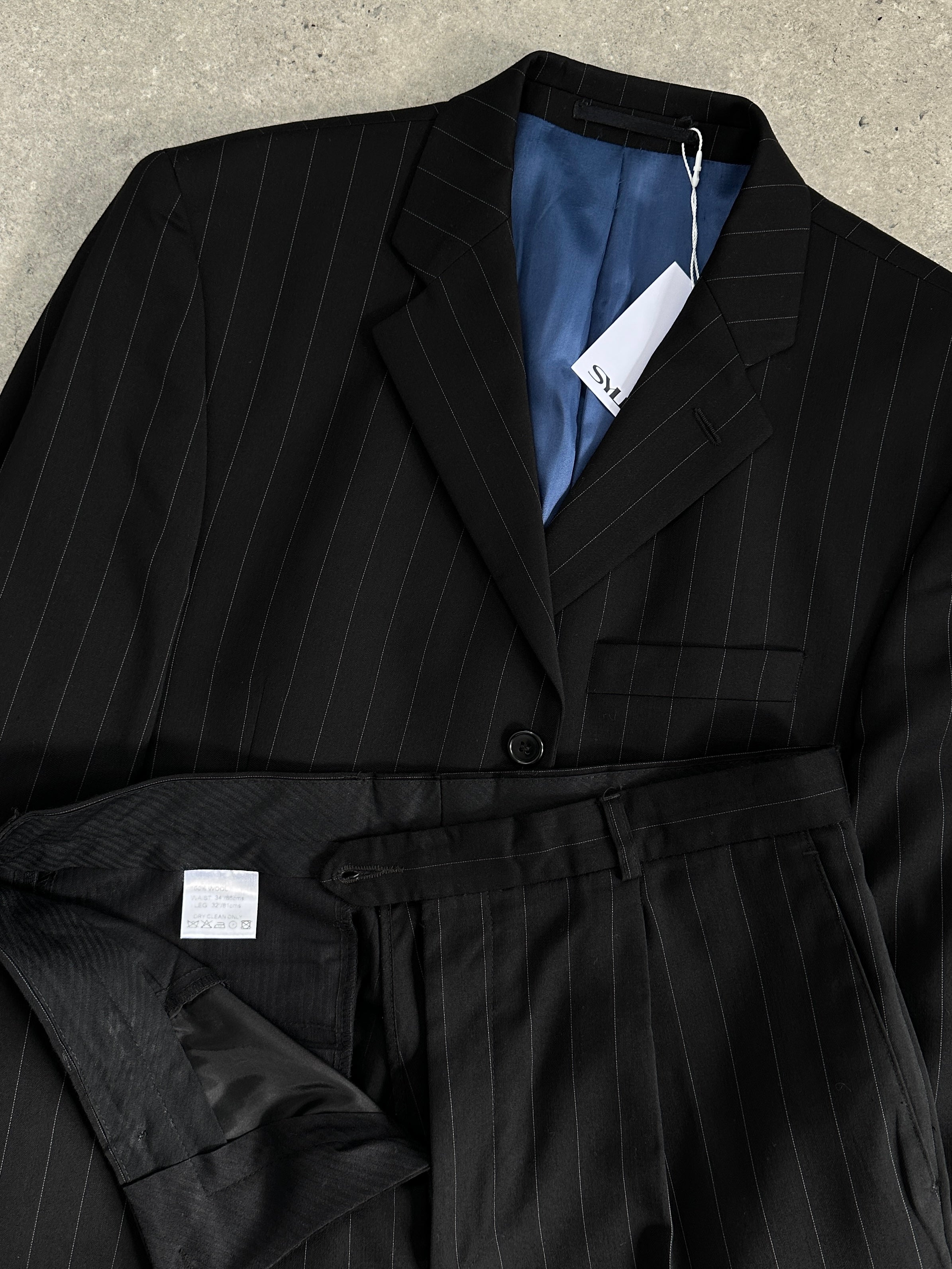 Vintage pure wool pinstripe jumpsuit, single-breasted suit in size 40R/W34, featuring classic pinstripe pattern and tailored fit.