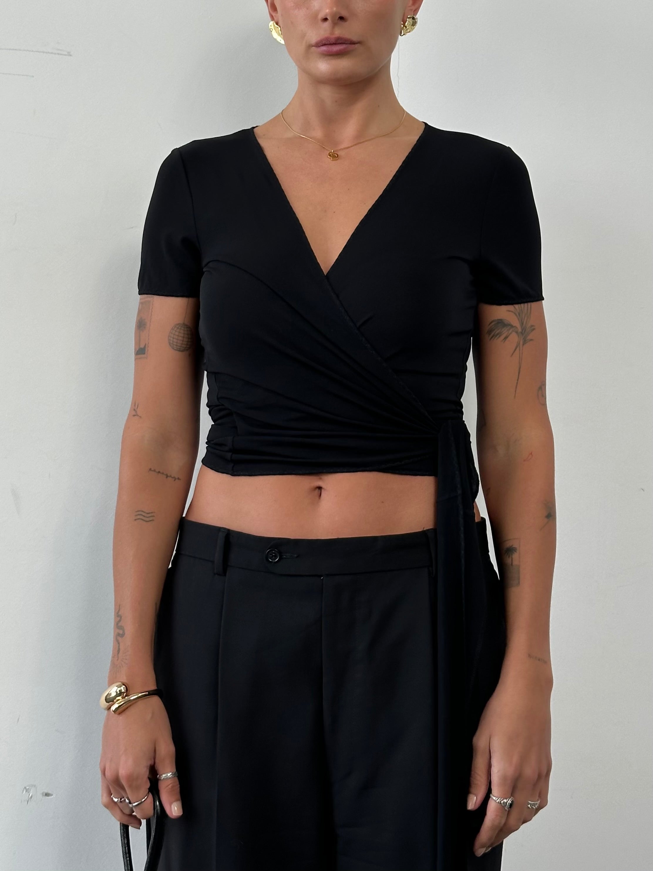 Marella tie wrap top in size M, featuring a stylish wrap design and lightweight fabric, shown on a hanger or model.