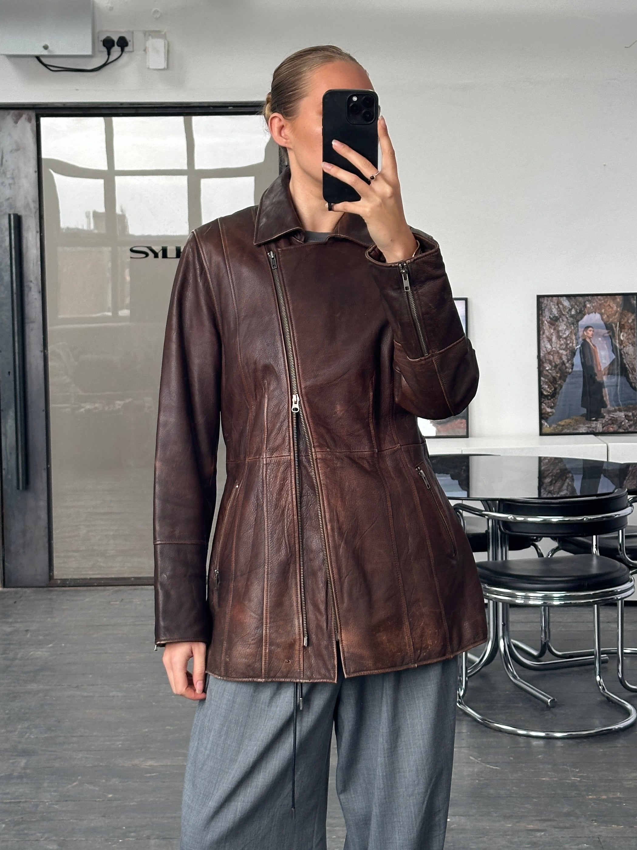 Vintage 1990s aged leather jacket with double zippers and belt, size large, featuring a rugged, classic design.