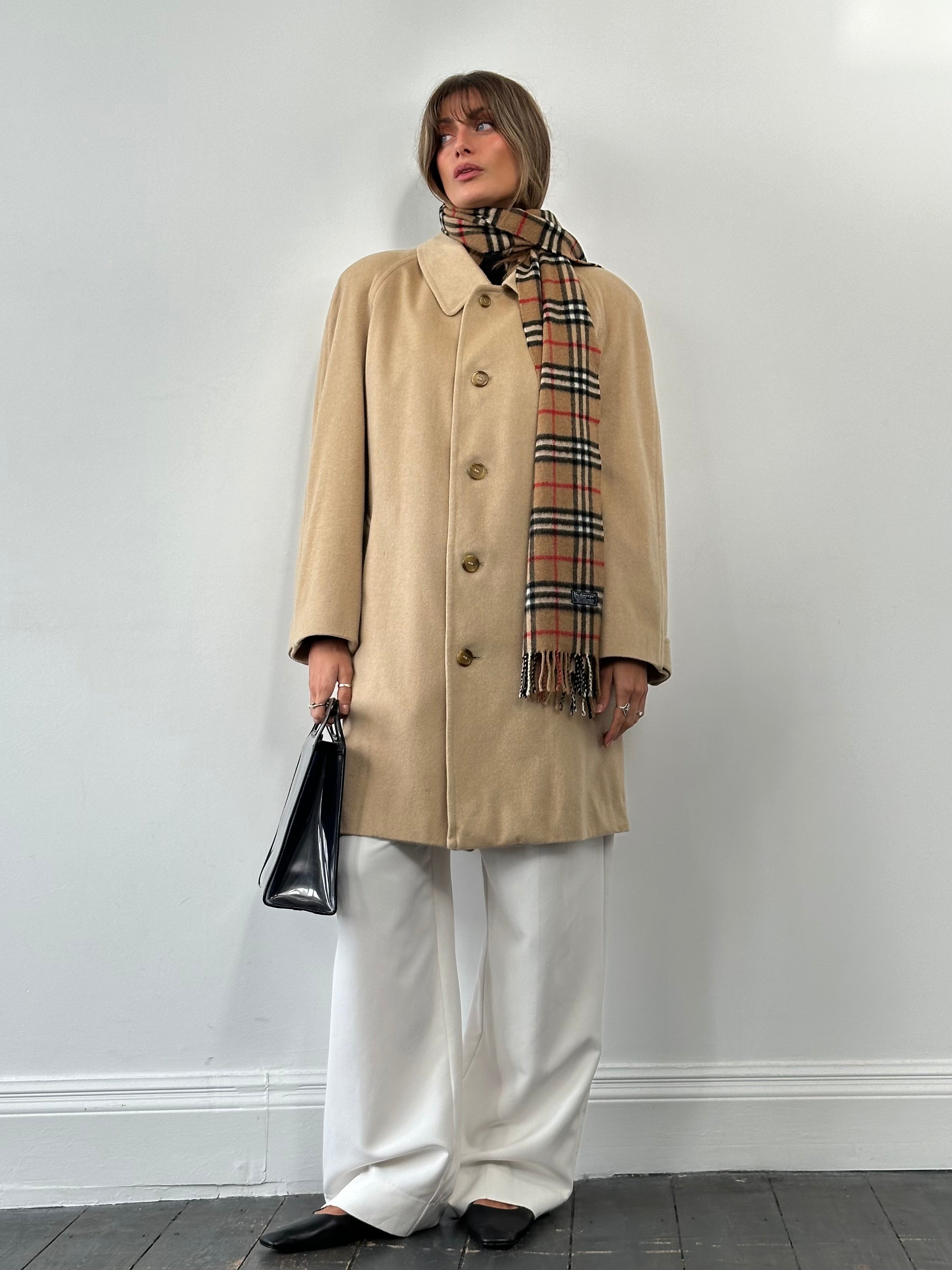 Burberry pure cashmere double-faced single-breasted coat in size L, shown hanging with classic design and beige color.