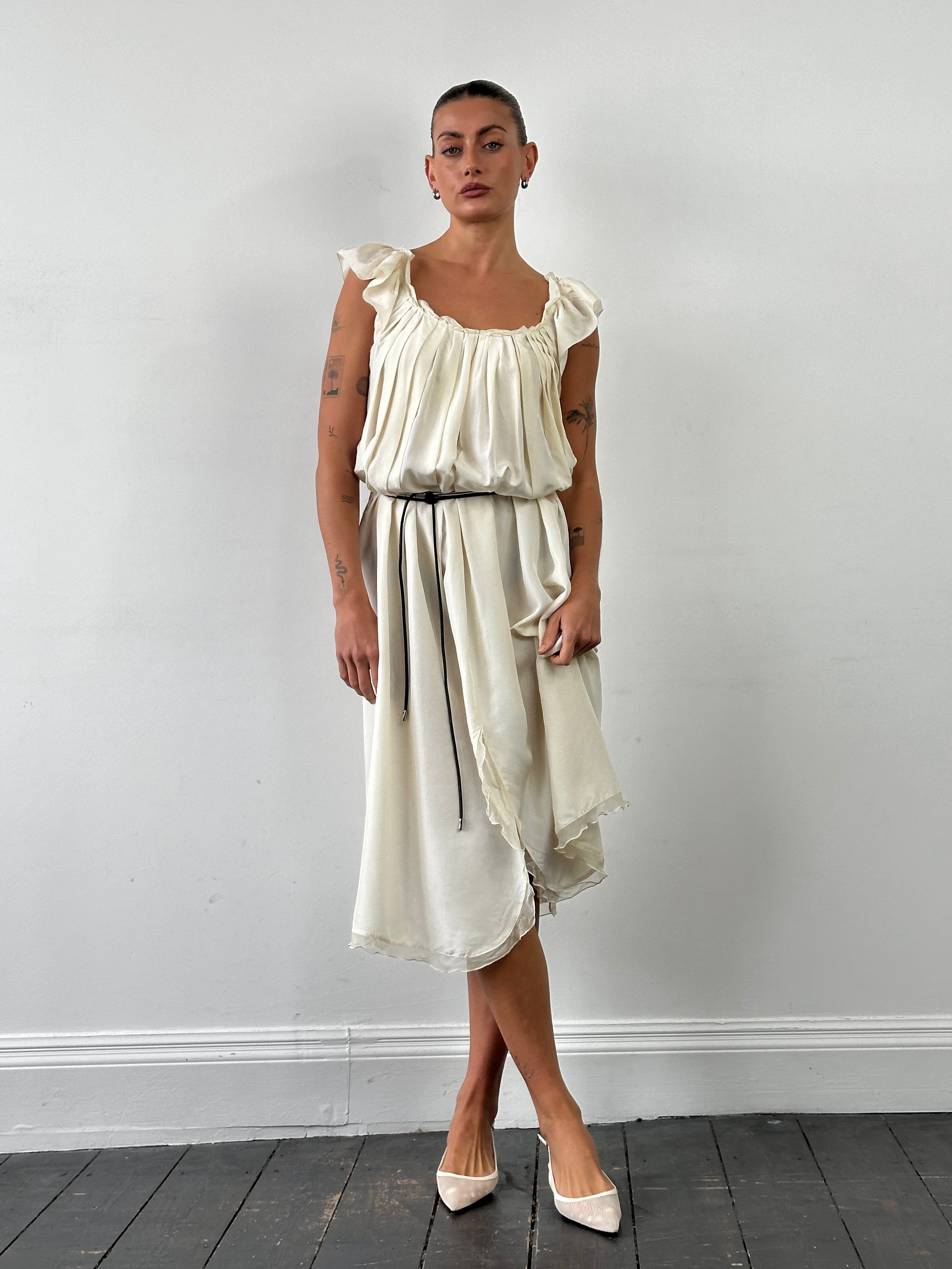 Prada 2012 pure silk pleated slip dress in size L, featuring elegant fabric and classic design, displayed on a mannequin.