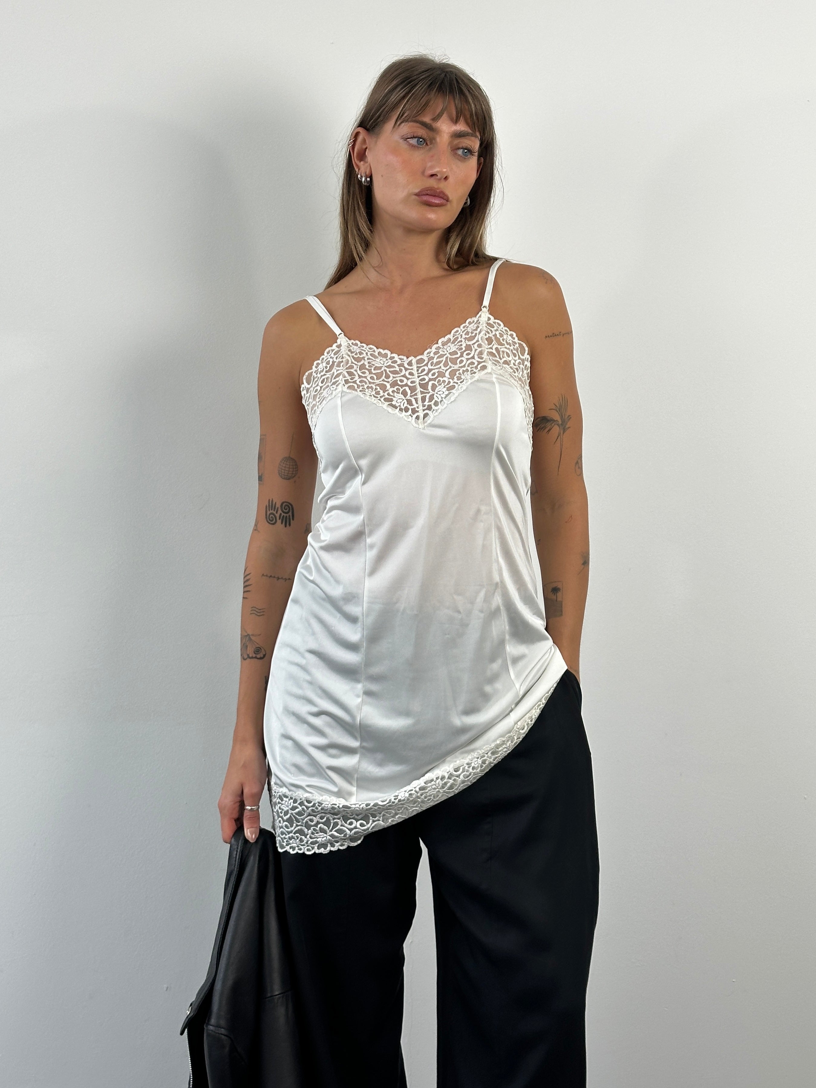 Vintage Japanese 1990s lace sheer mini slip dress in size S, featuring delicate lace details and a lightweight, vintage style.