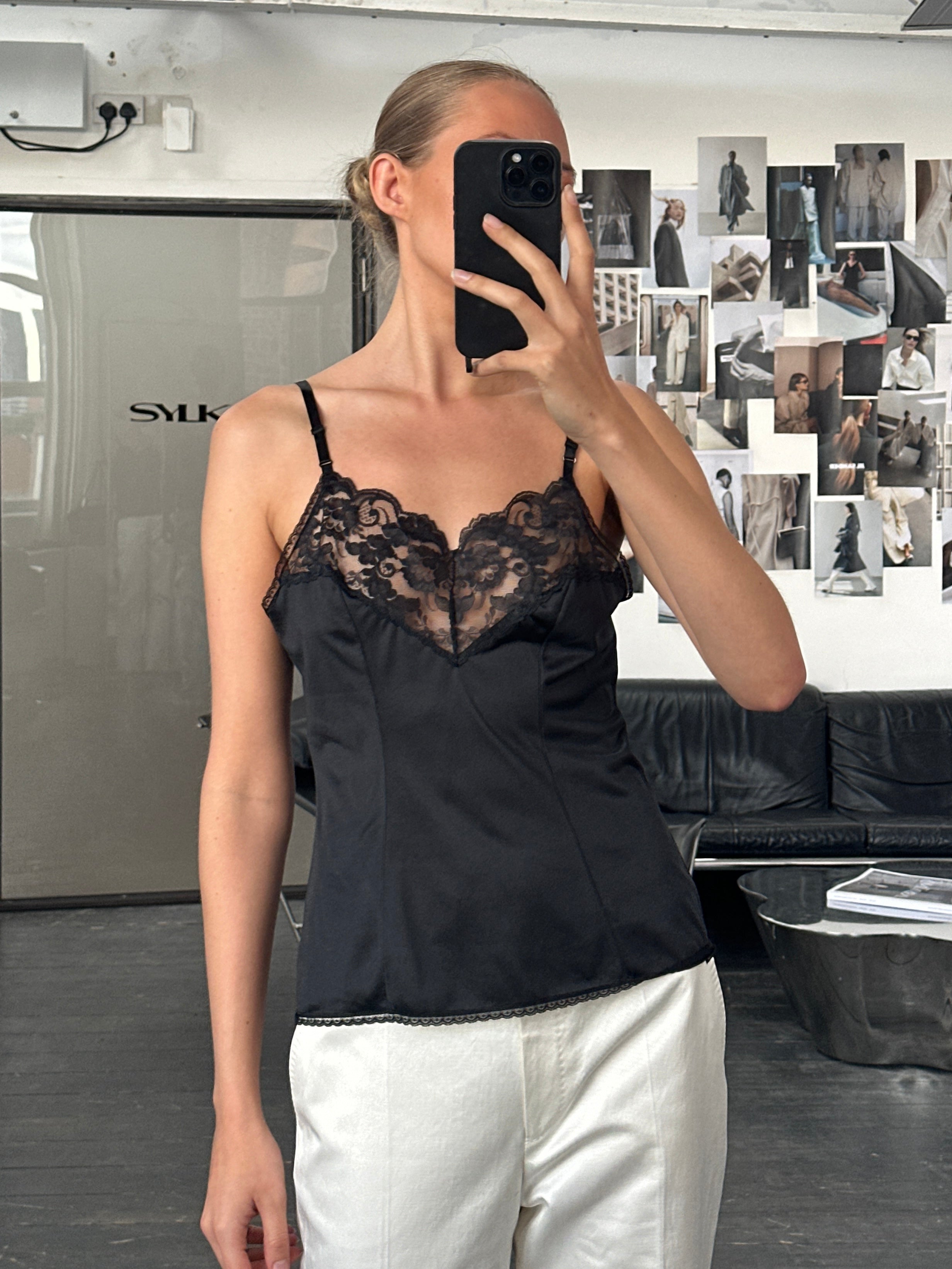 Vintage USA 1980s lace cami top, medium size, featuring delicate lace detailing and vintage style on a hanger.