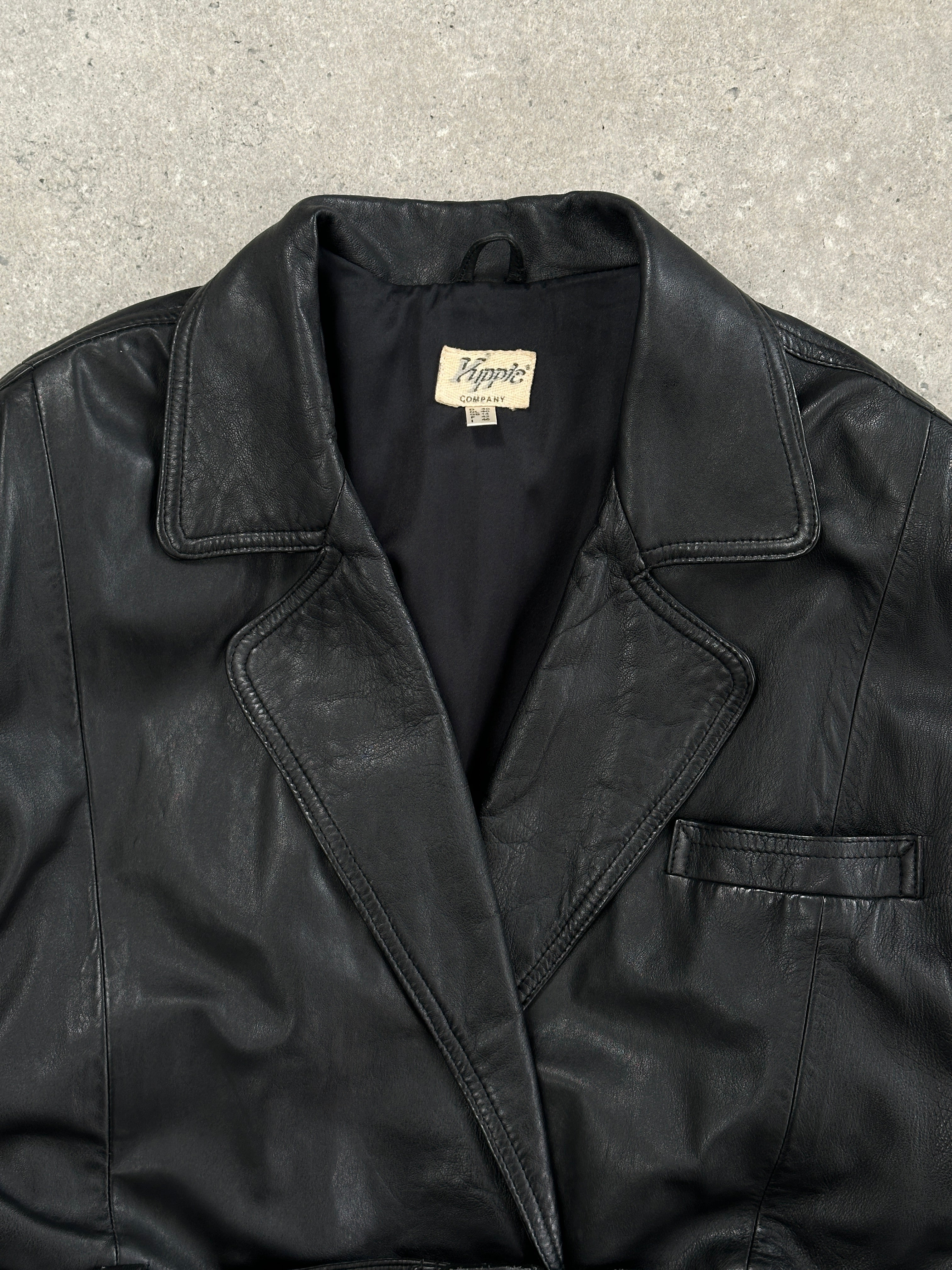 Vintage 90s belted leather jacket, size large, featuring classic design and detailed stitching, perfect for retro fashion style.
