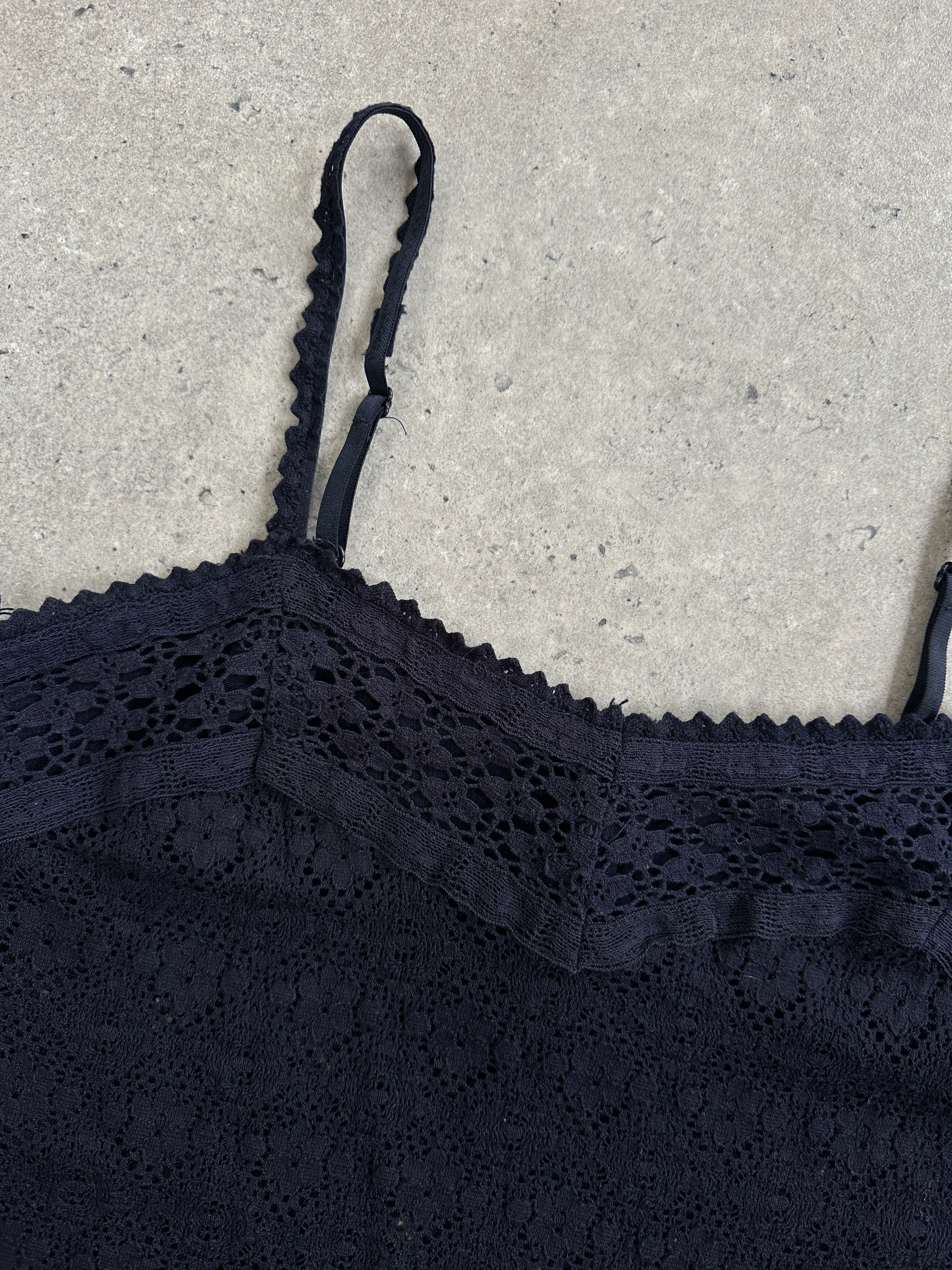 Vintage 2000s crochet cami top in black, featuring delicate lace details and a fitted S/M silhouette.