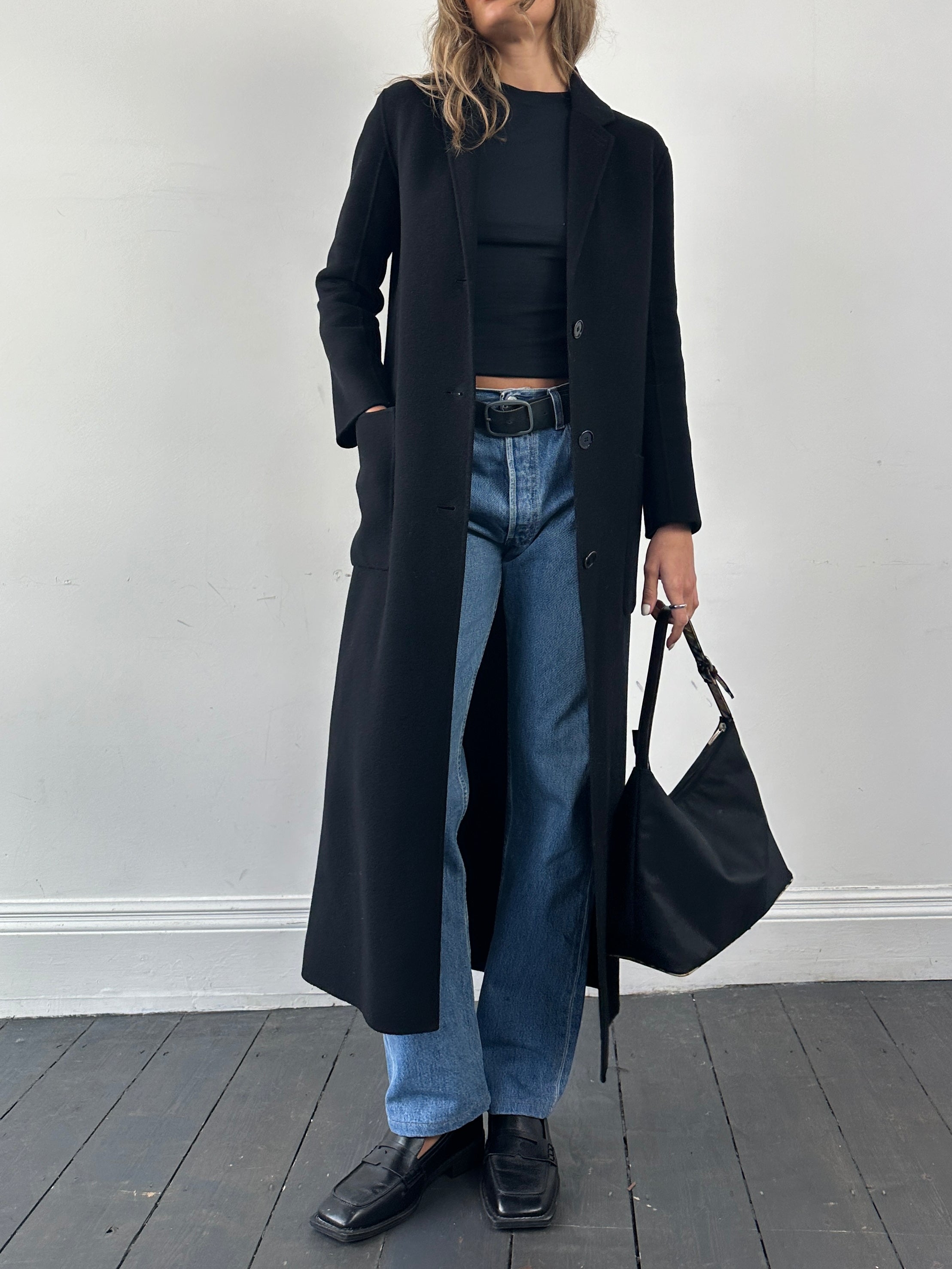 The Kooples double-faced pure wool unlined coat in XS/S, floor-length, shown hanging with front view and classic collar detail.