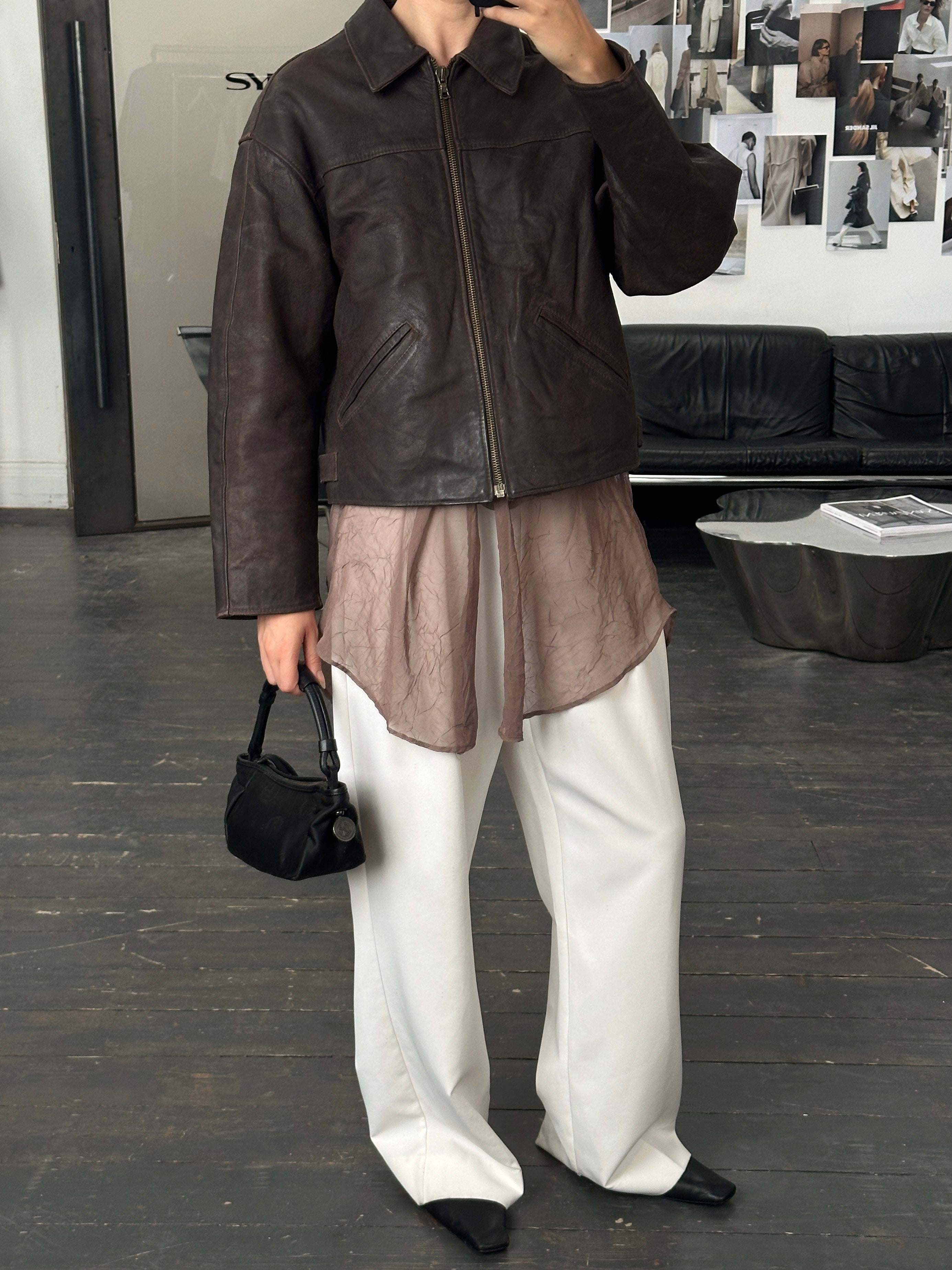 Vintage 1980s cropped leather jacket in size L, stylish retro jacket with classic design and textured leather material.