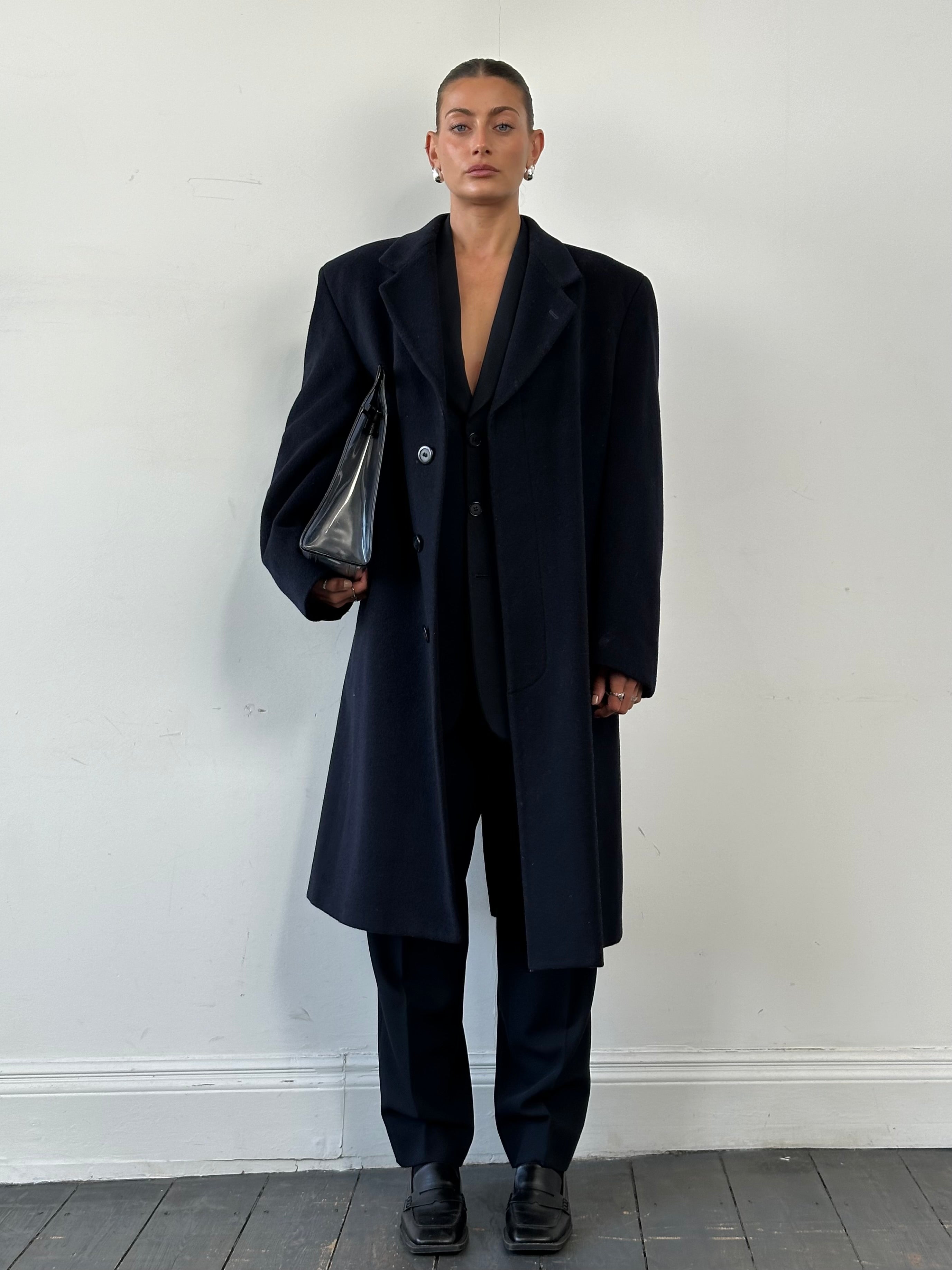 Vintage British wool and cashmere coat with concealed placket in size 42R/XL, showcasing classic tailored design.