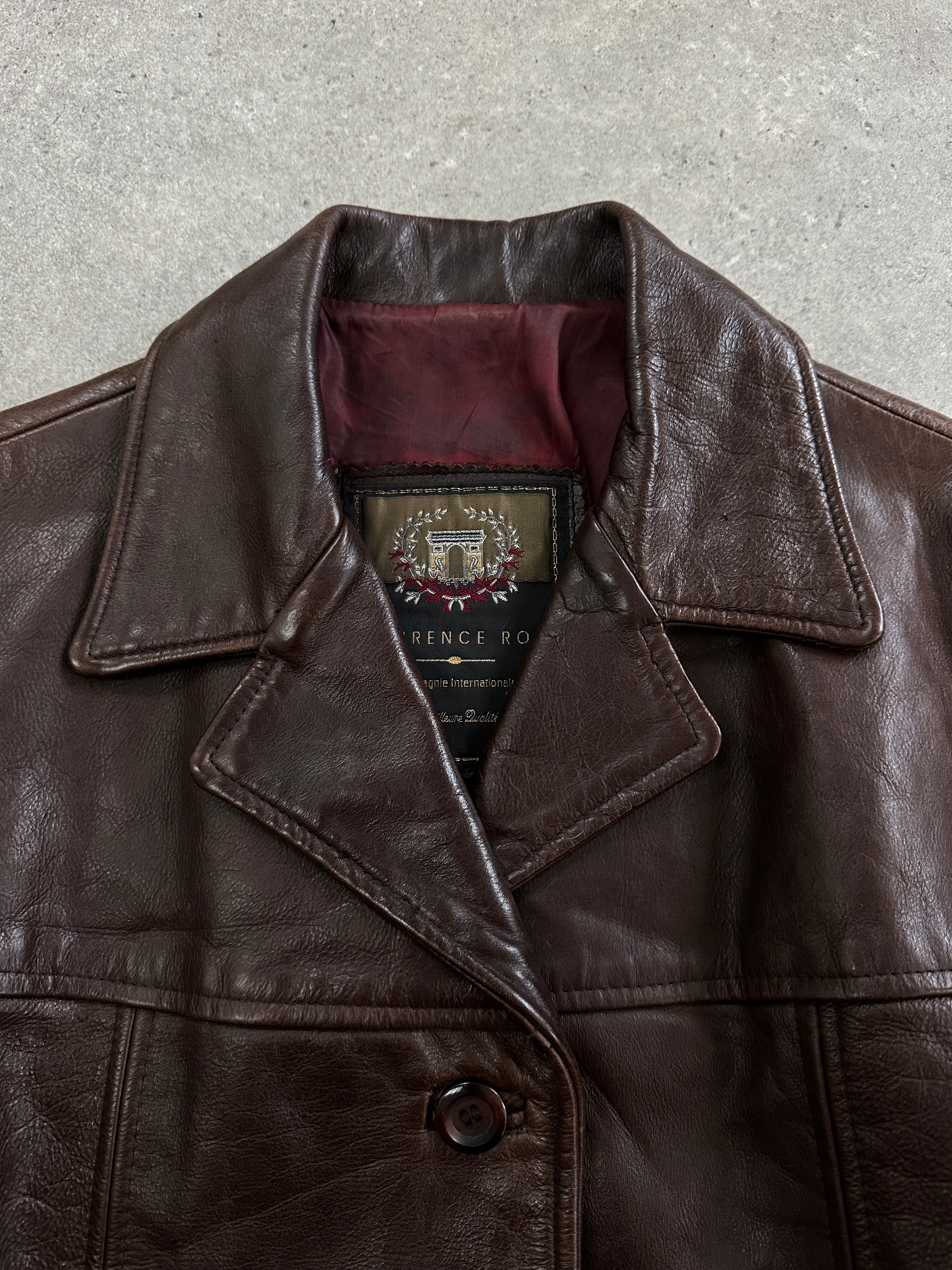Vintage 1990s high button leather jacket in size M, classic black leather with metal button details and a timeless style.