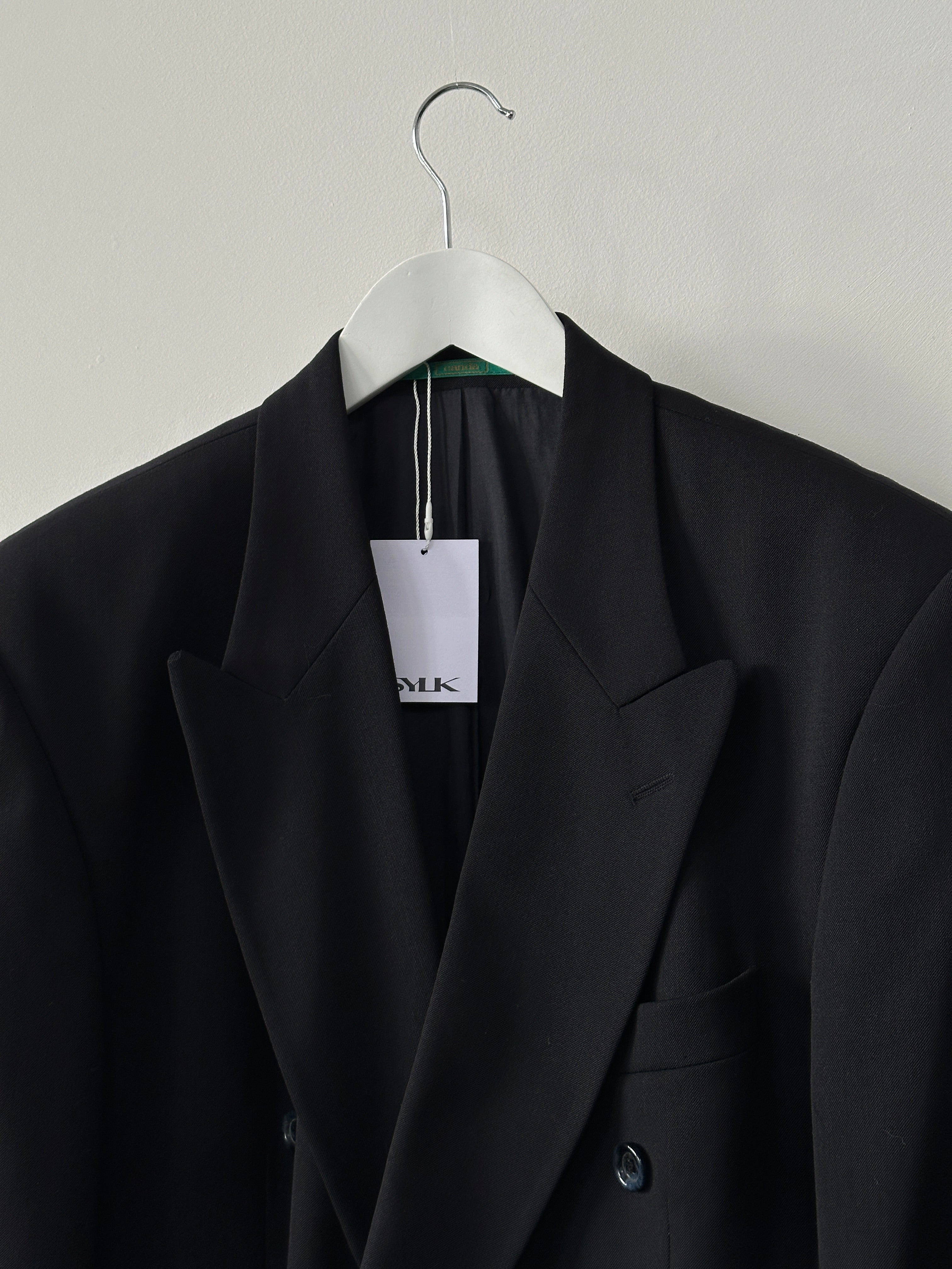 Vintage double-breasted wool blazer in size XL, featuring classic tailored design and textured fabric.