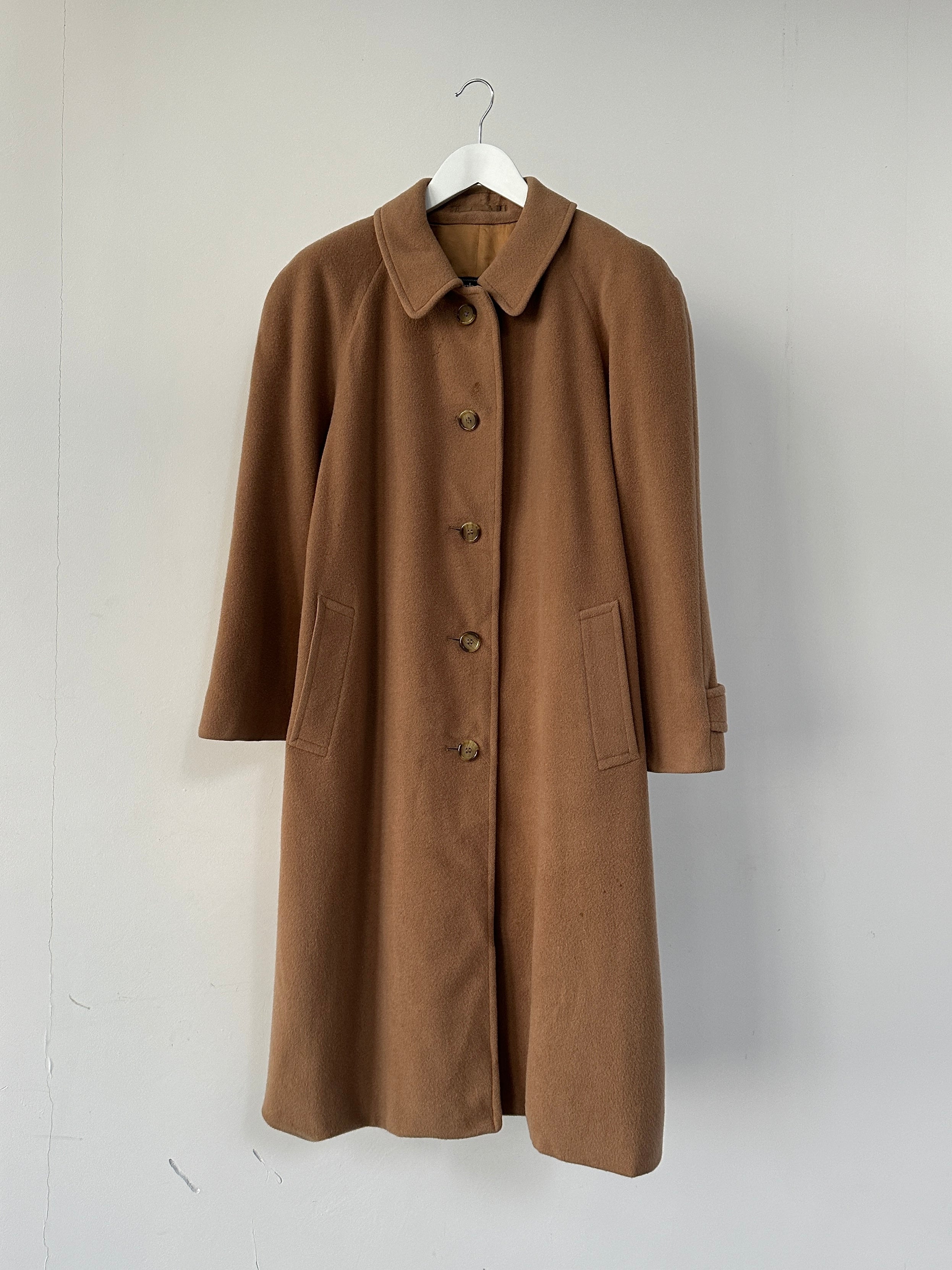 Burberry wool camel hair single-breasted coat in size L hanging on a hanger with a classic design and tailored fit.