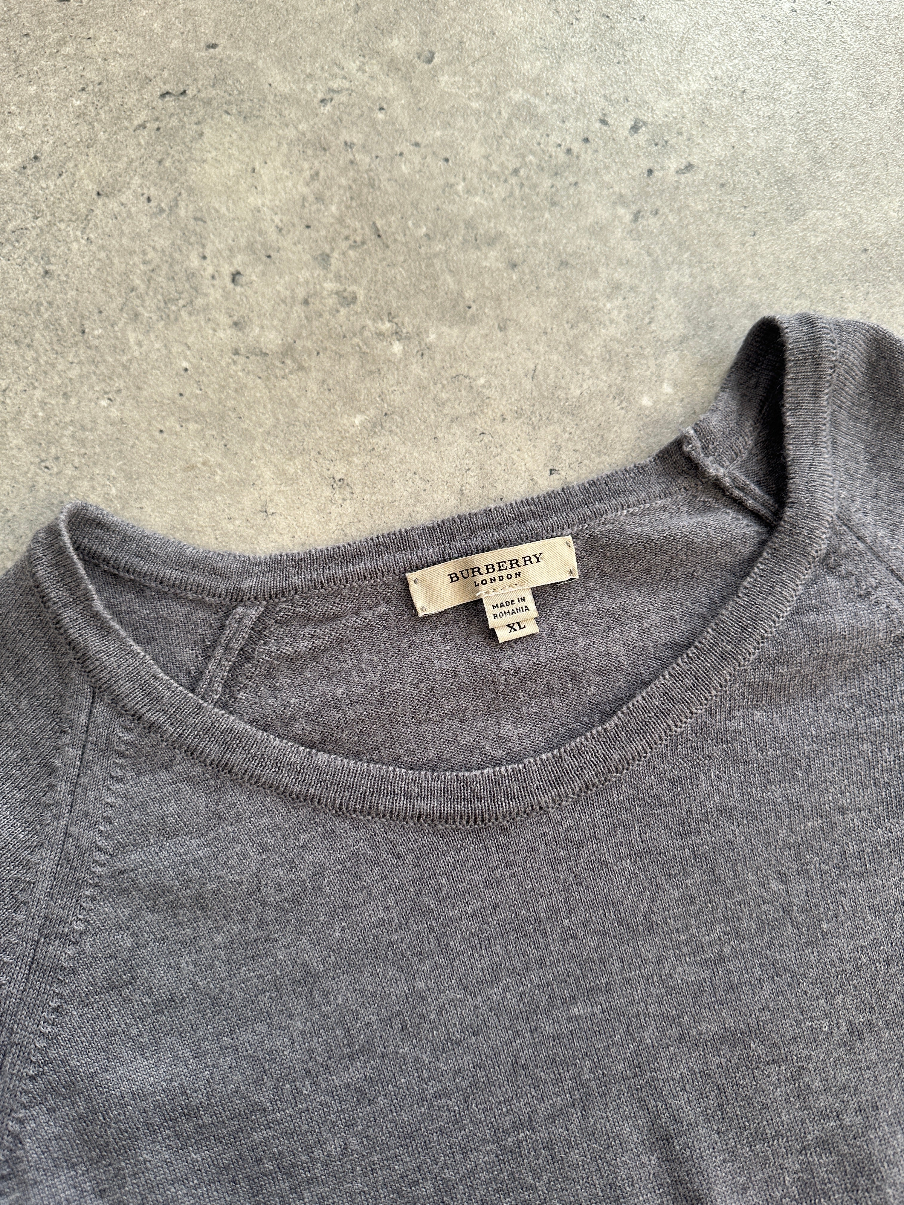 Burberry London 2000s pure merino wool knitted jumper in size M with logo design, featuring a cozy, textured knit pattern.