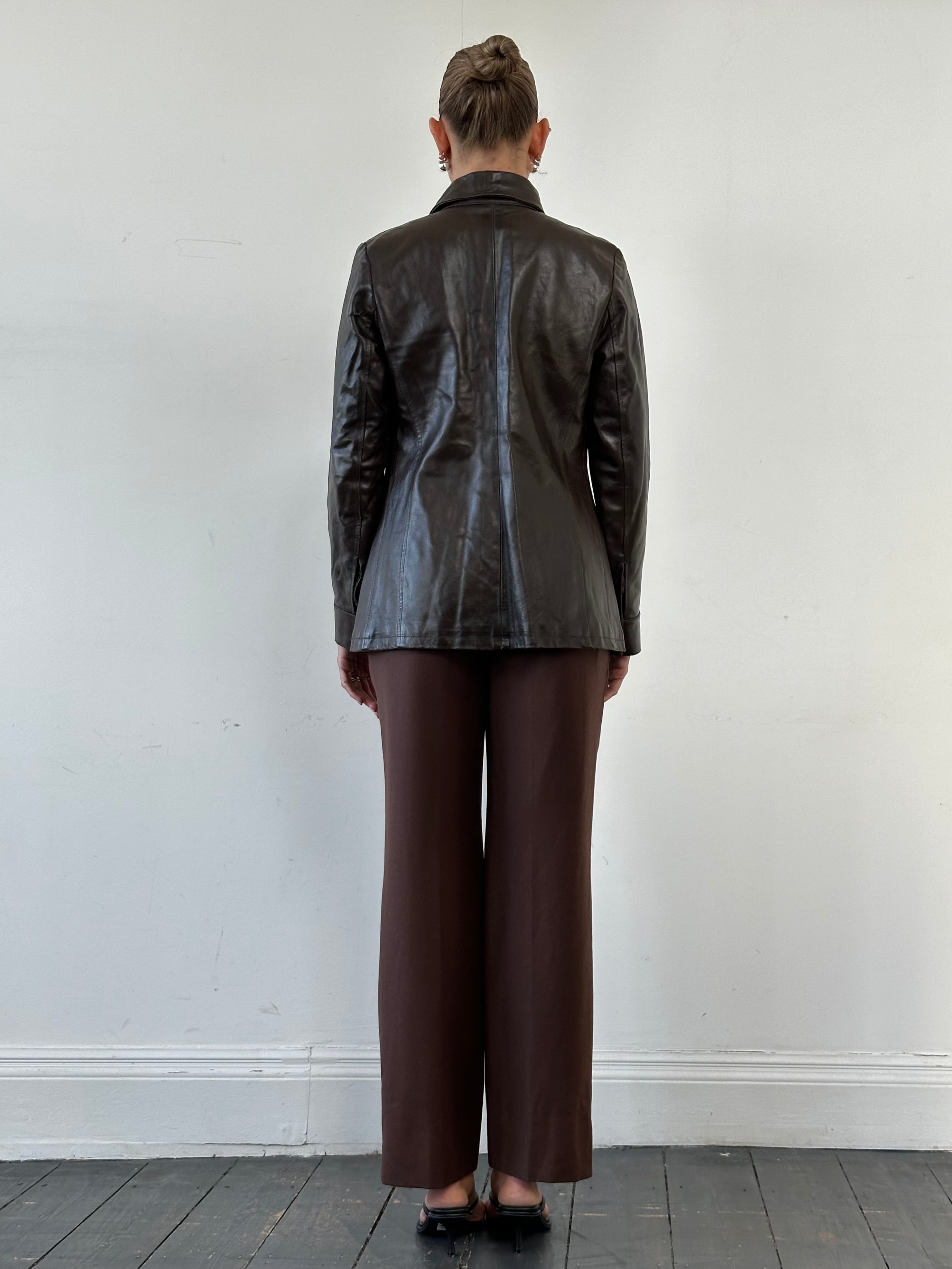 Vintage smooth leather jacket for men, size small, featuring classic design and high-quality leather material.