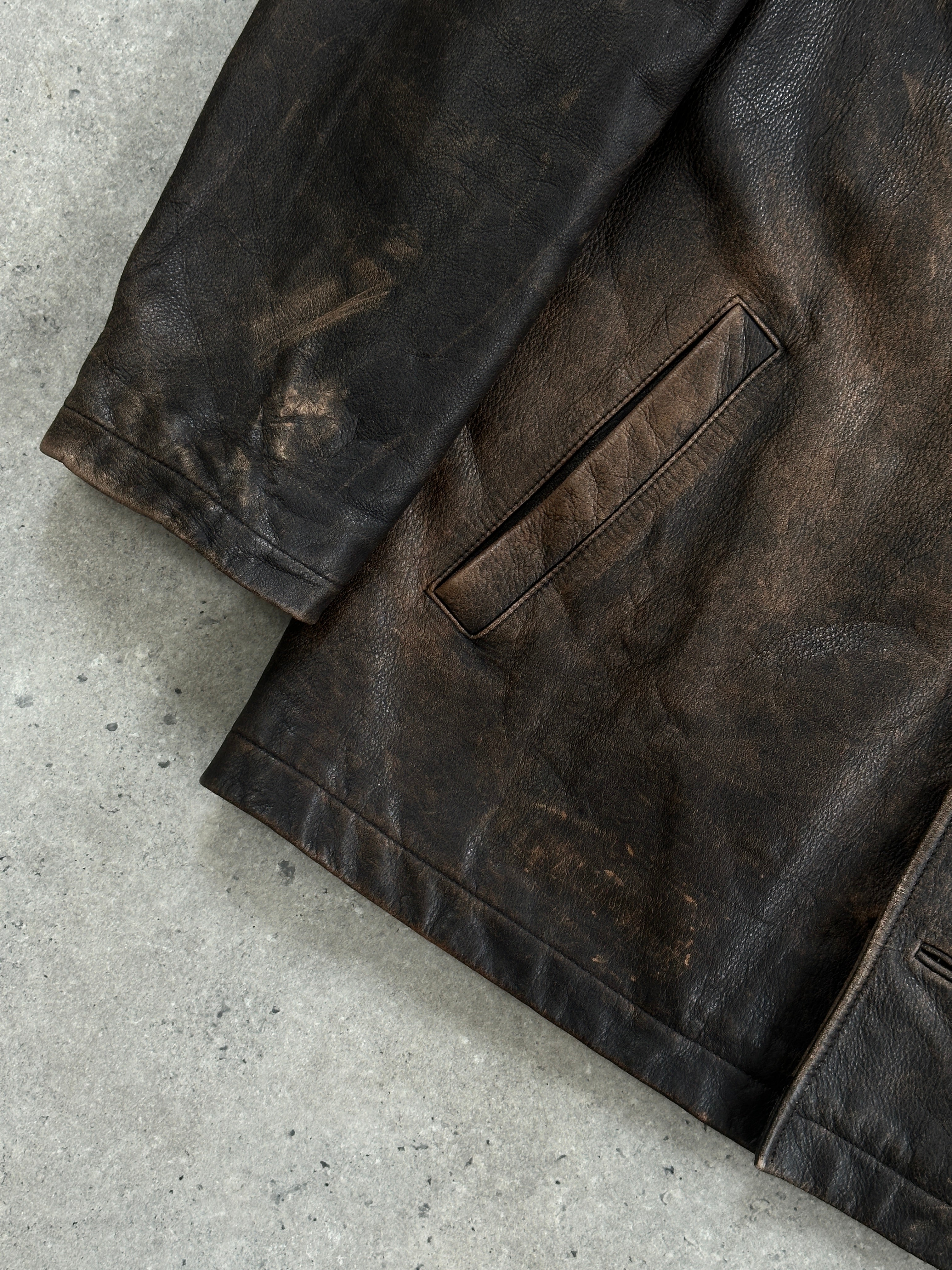 Guess distressed leather jacket in XL size, featuring a rugged design with visible stitching and a classic collar.