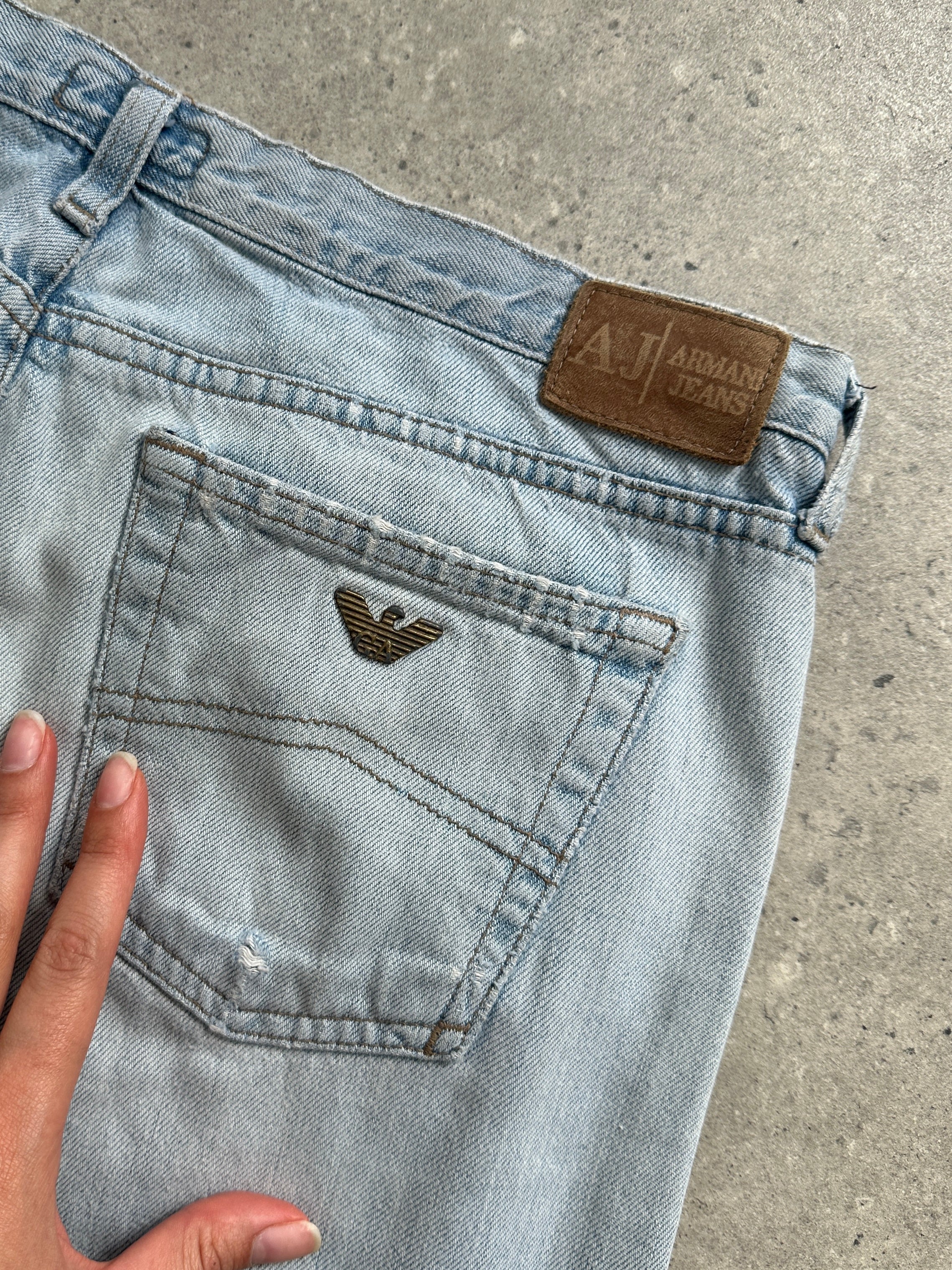 Armani Jeans light wash mid-rise denim jeans with classic five-pocket design and straight leg fit, size W30.