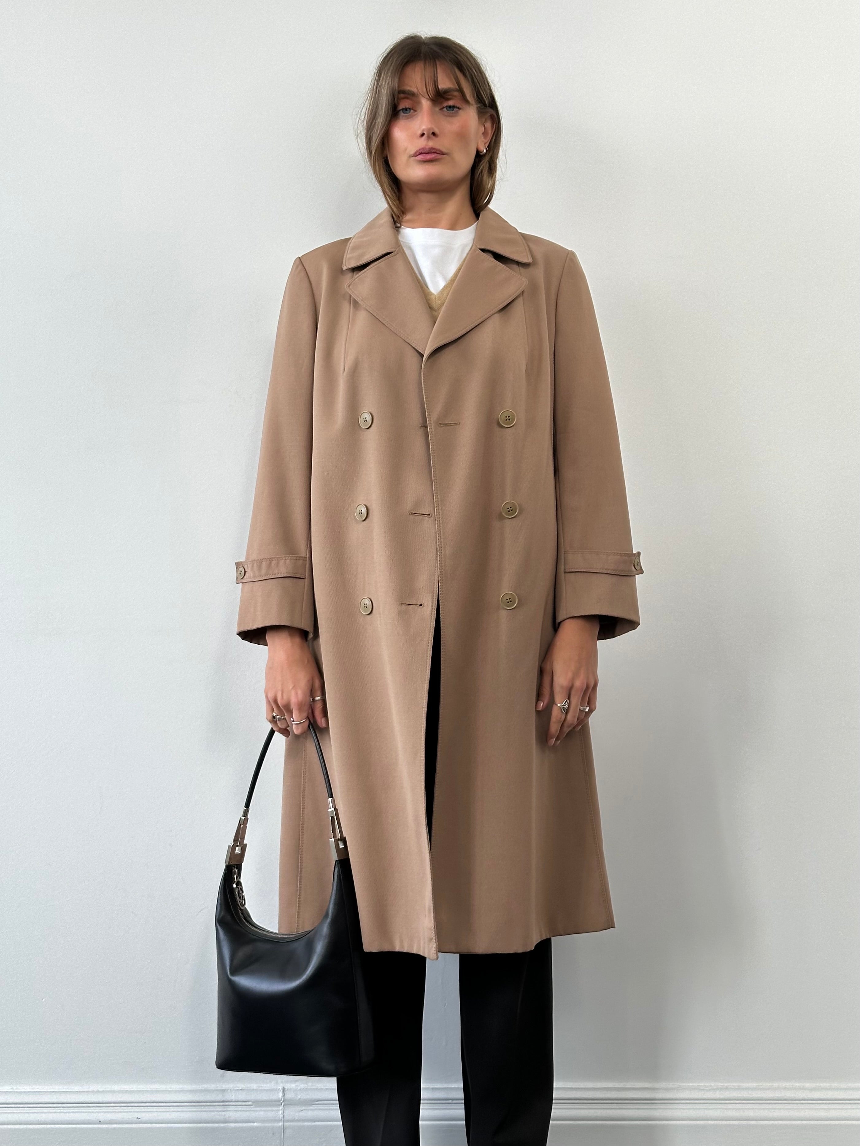 Vintage pure virgin wool double-breasted belted trench coat in beige, shown on a hanger with classic style details.
