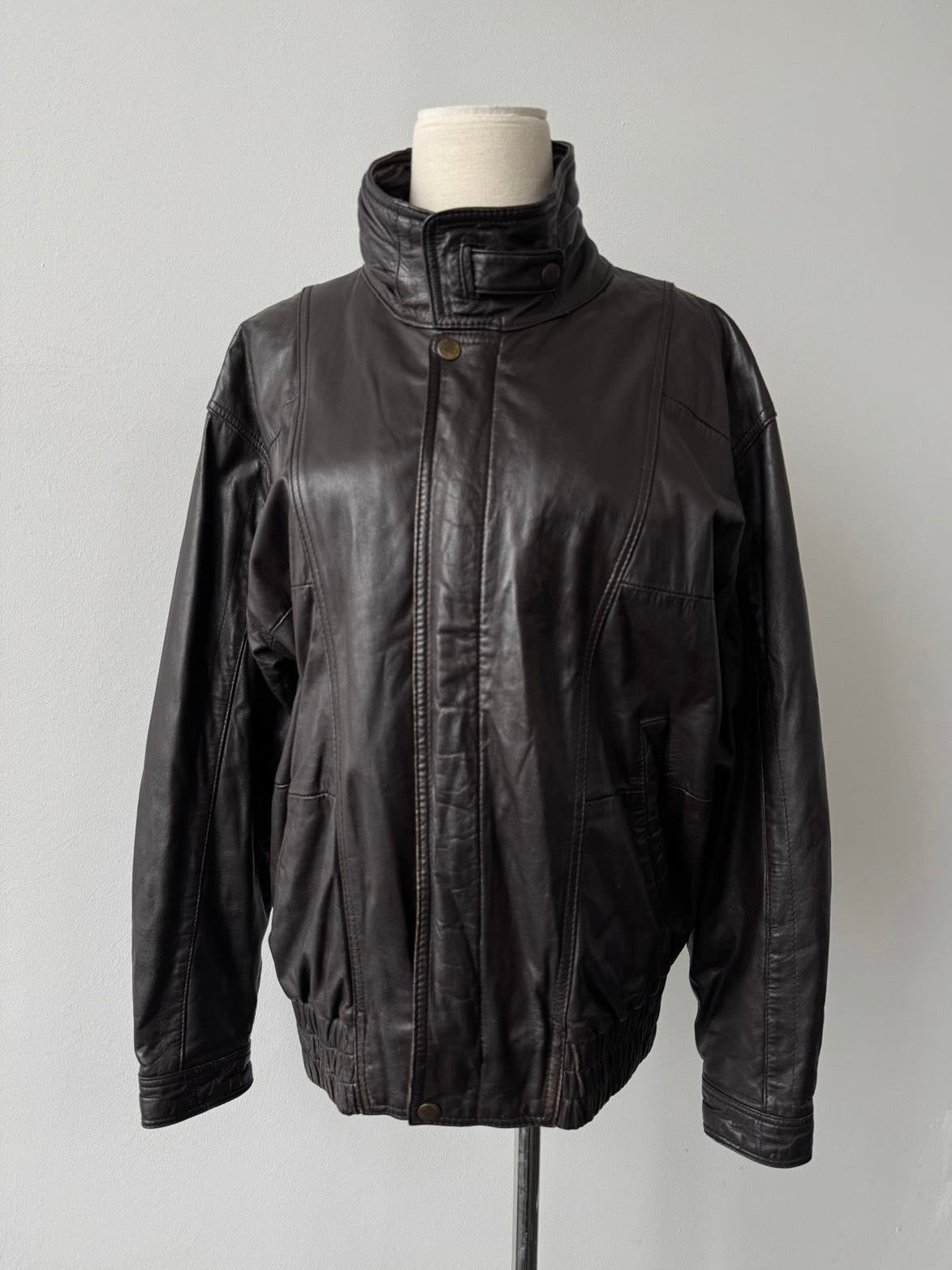 Valentino 1990s high neck leather bomber jacket, slim fit, black leather with ribbed cuffs and collar, front zipper closure.