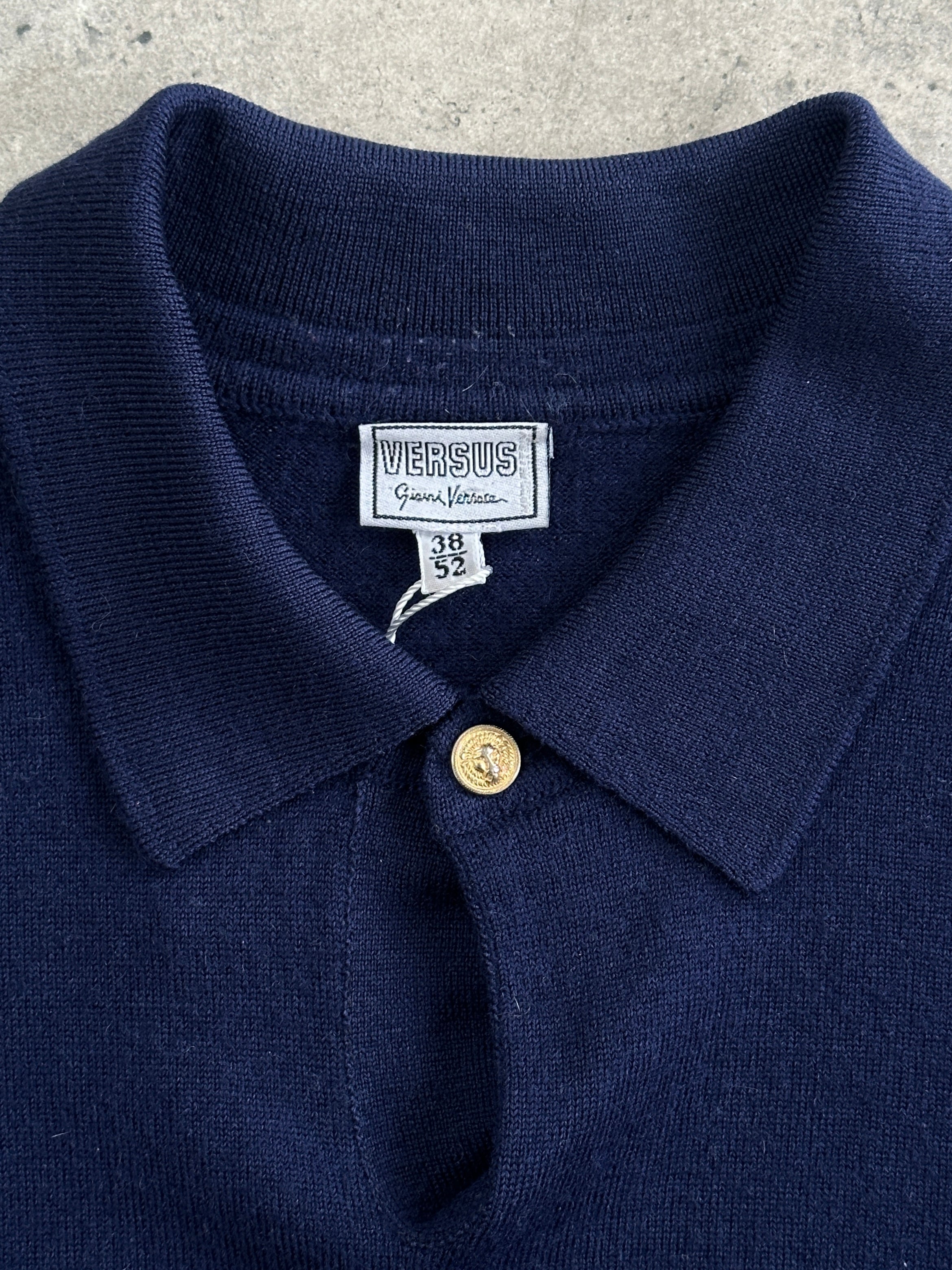 Versace Versus 1990s pure wool bespoke button polo jumper in size L, featuring classic design and ribbed collar.
