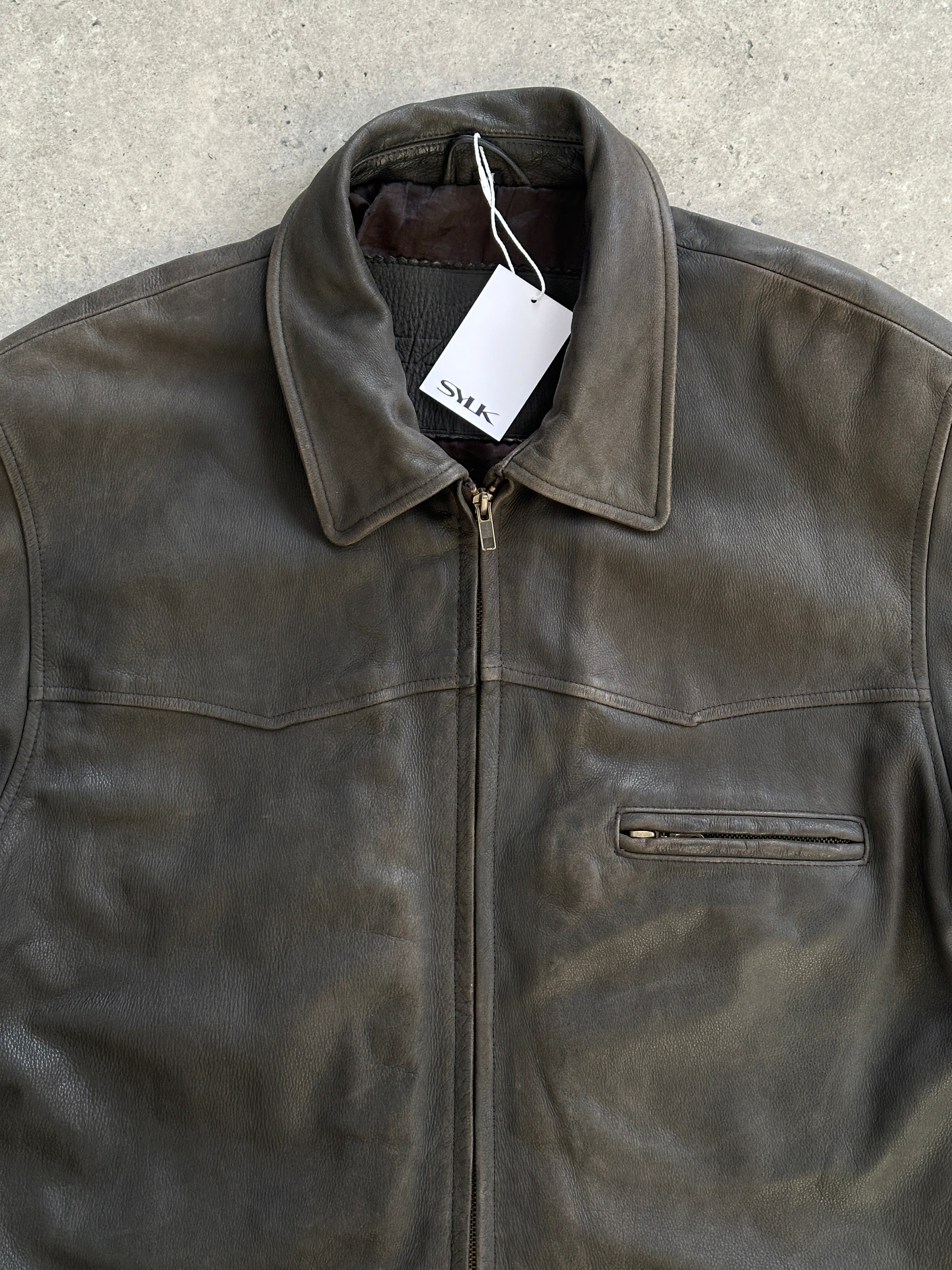 Vintage brand vintage mid-length leather jacket in size L/XL displayed on a hanger, showcasing classic design and rich leather texture.
