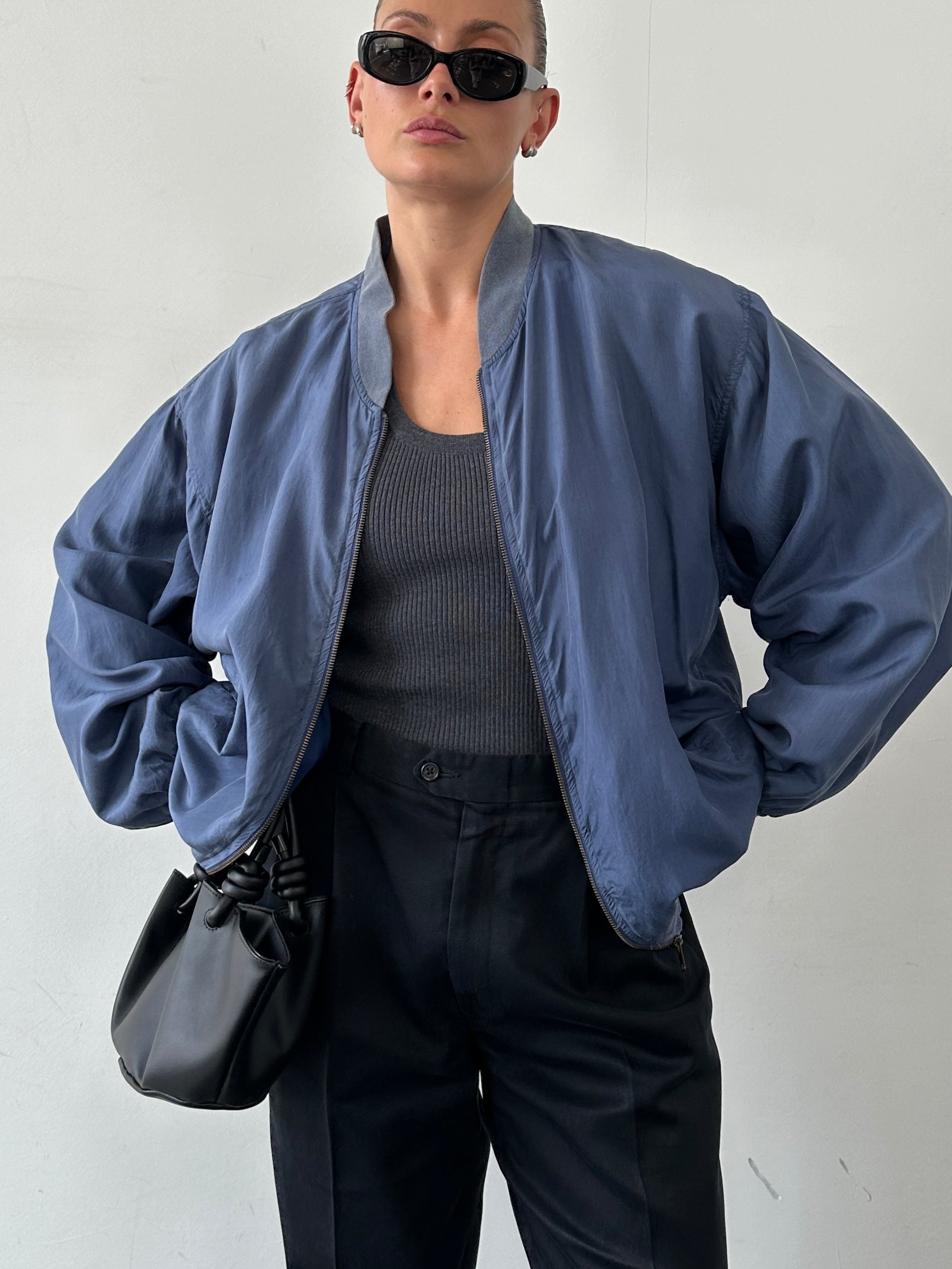Vintage pure silk bomber jacket in XL, showcasing smooth fabric and classic design with ribbed cuffs and collar.