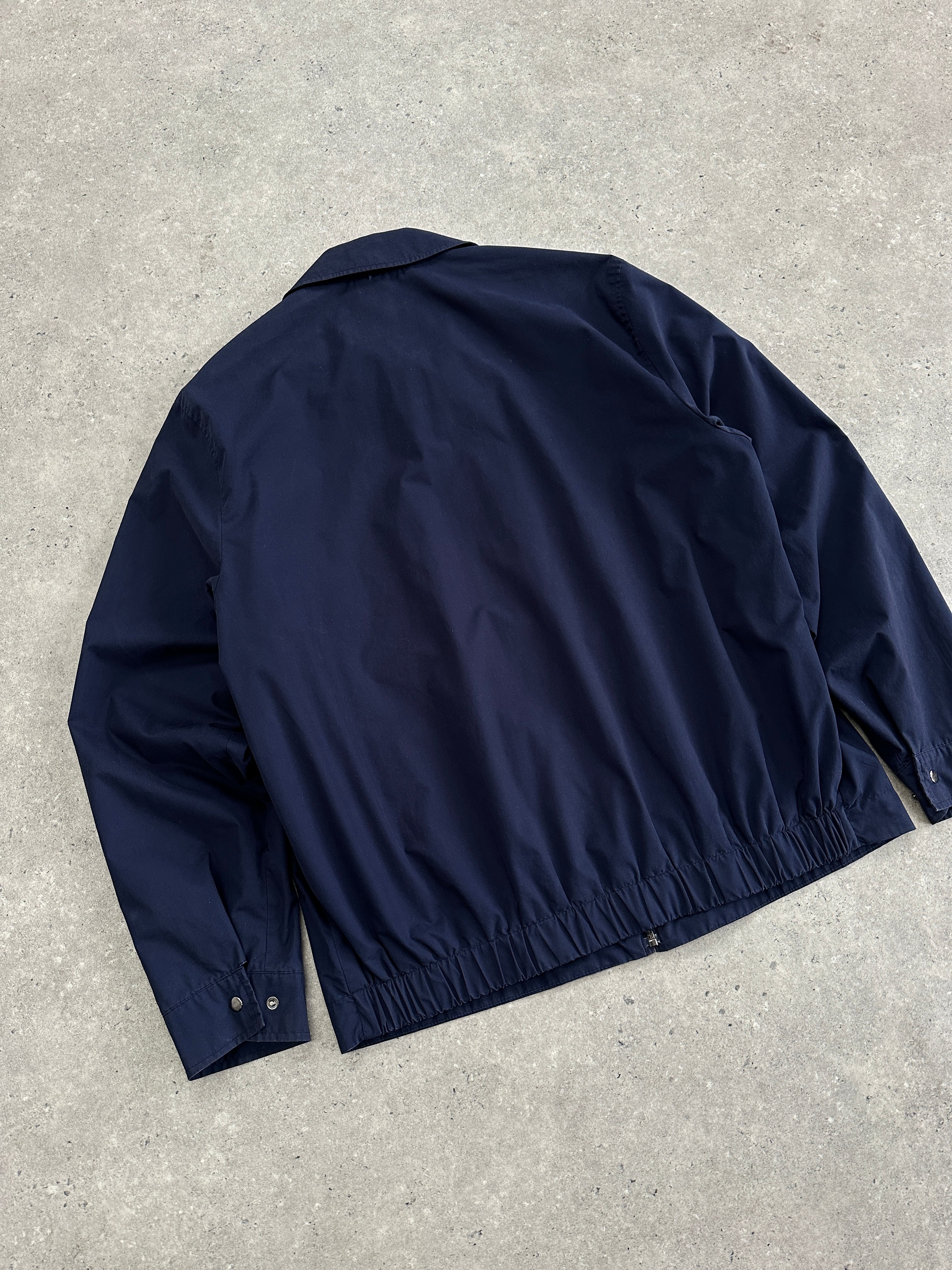 Yves Saint Laurent Pour Homme cotton logo bomber jacket in black, featuring the YSL branding and a classic bomber style.
