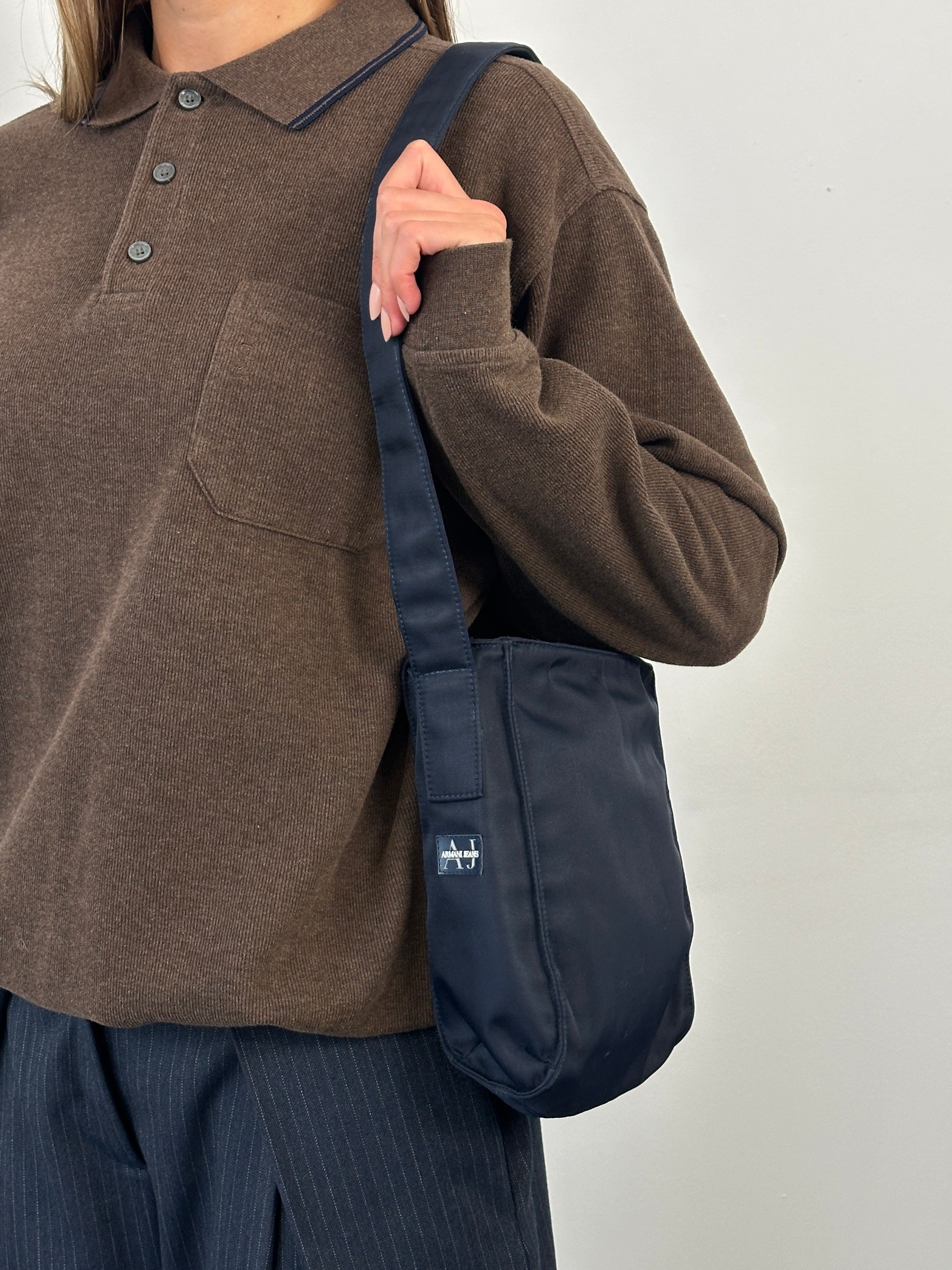 Armani Jeans 2000s nylon shoulder bag with adjustable strap and sleek design, featuring the Armani logo.