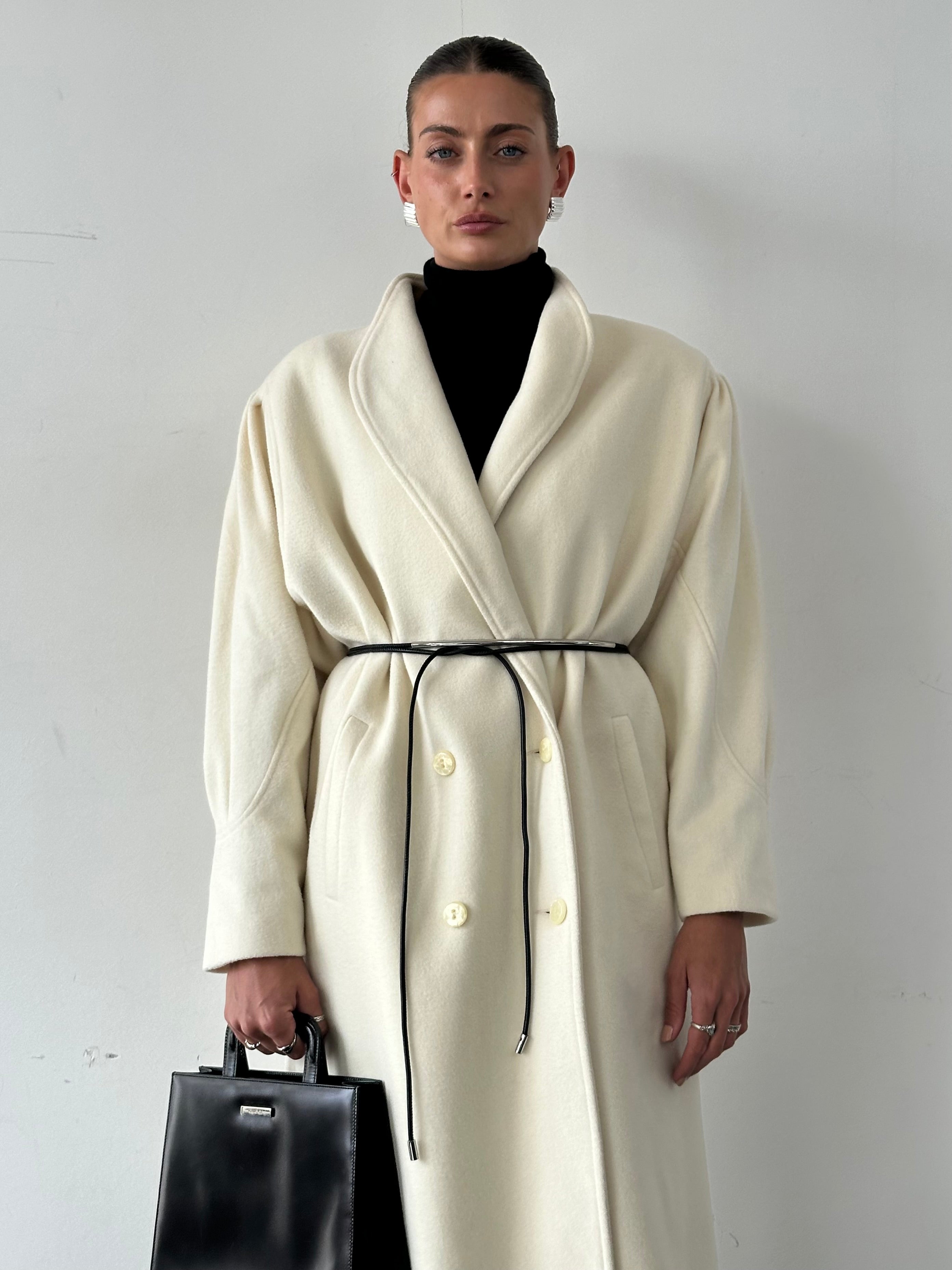 Vintage pure wool double-breasted coat in size L/XL, featuring classic design and warm fabric, ideal for stylish cold-weather wear.