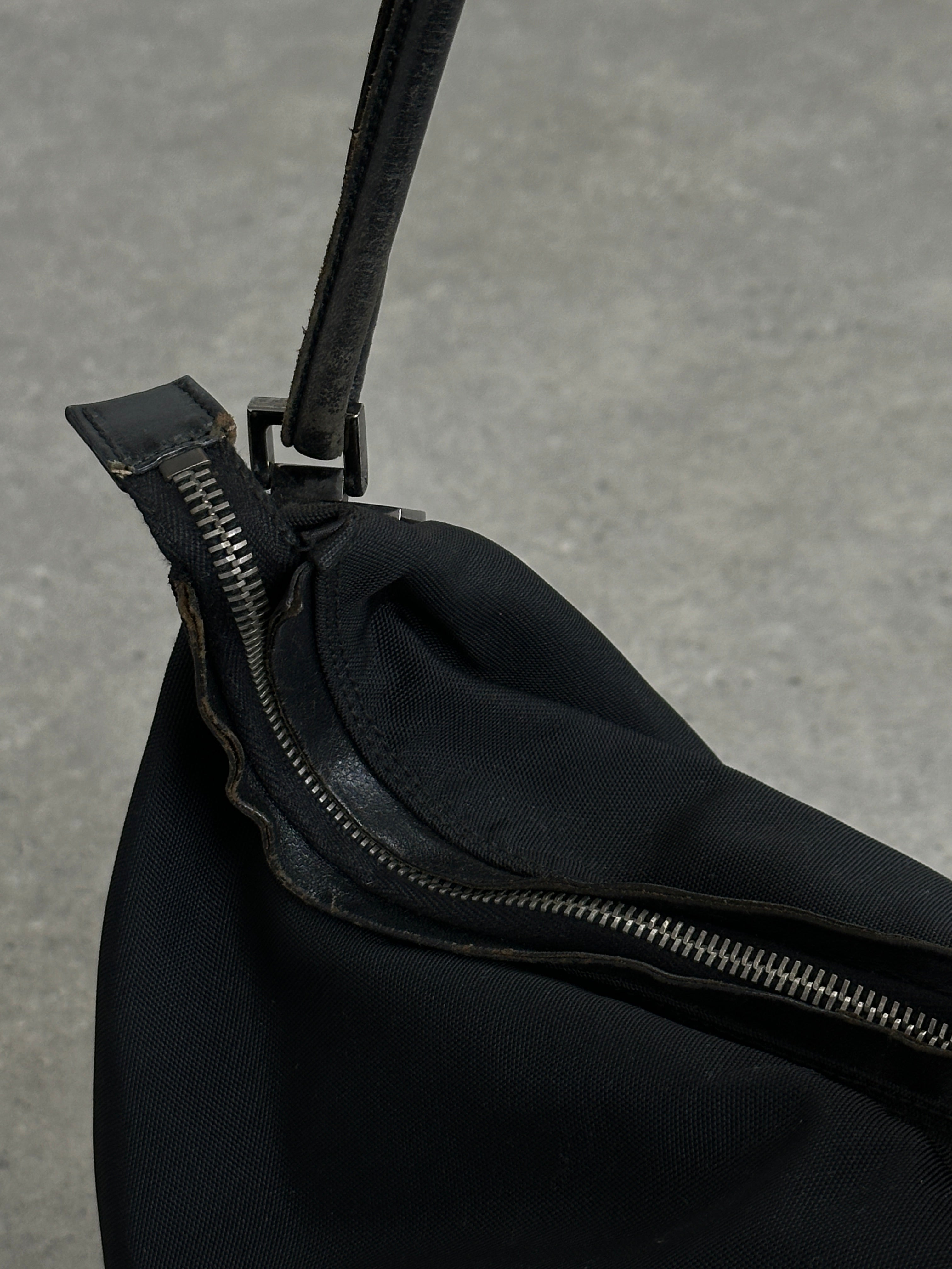 Gucci 1990s Tom Ford canvas leather hobo shoulder bag with adjustable strap and signature design details.