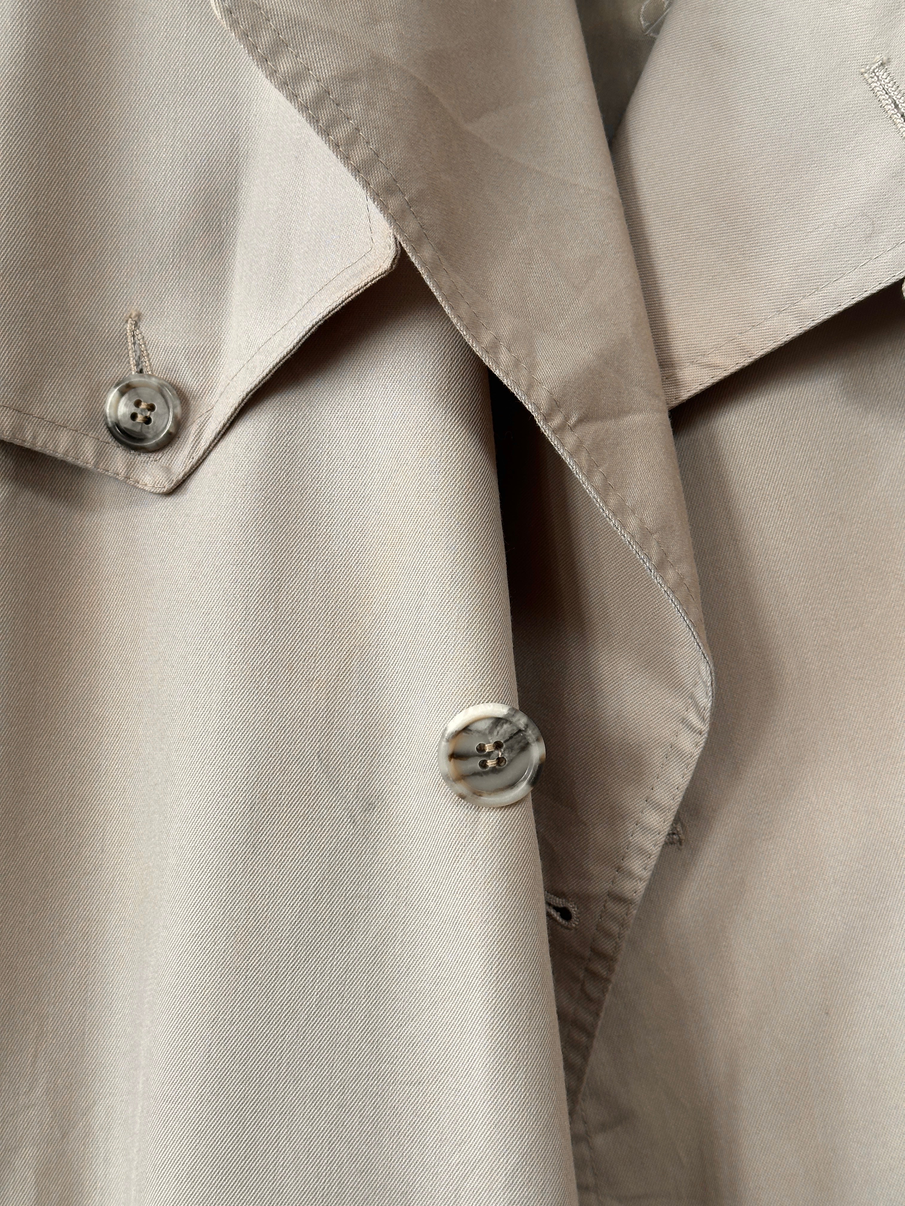 Christian Dior double-breasted trench coat in XL/XXL, tailored fit with classic design and stylish collar, shown in beige fabric.