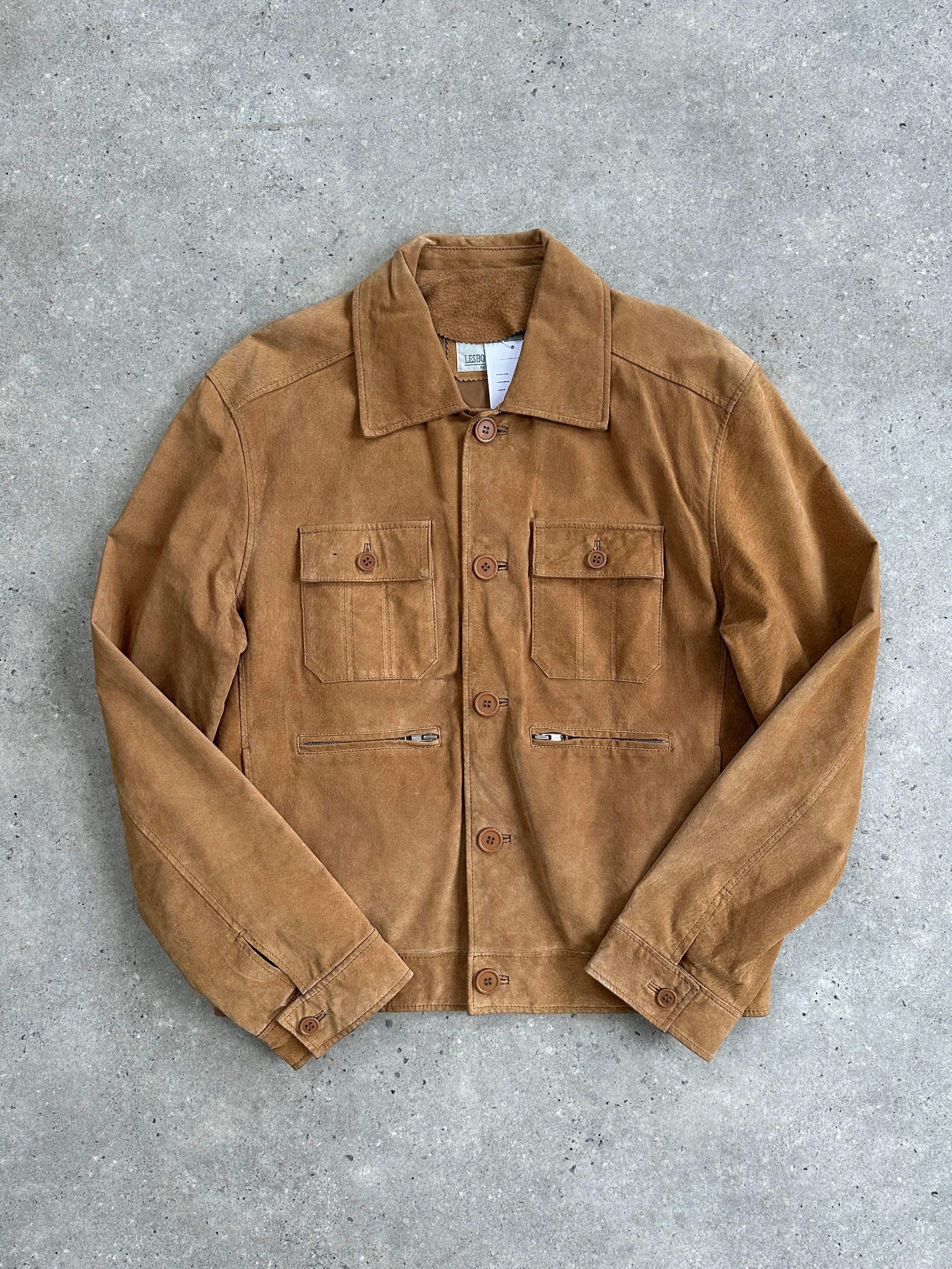 Vintage suede trucker jacket in size M/L, featuring classic design with button closures and a retro style.