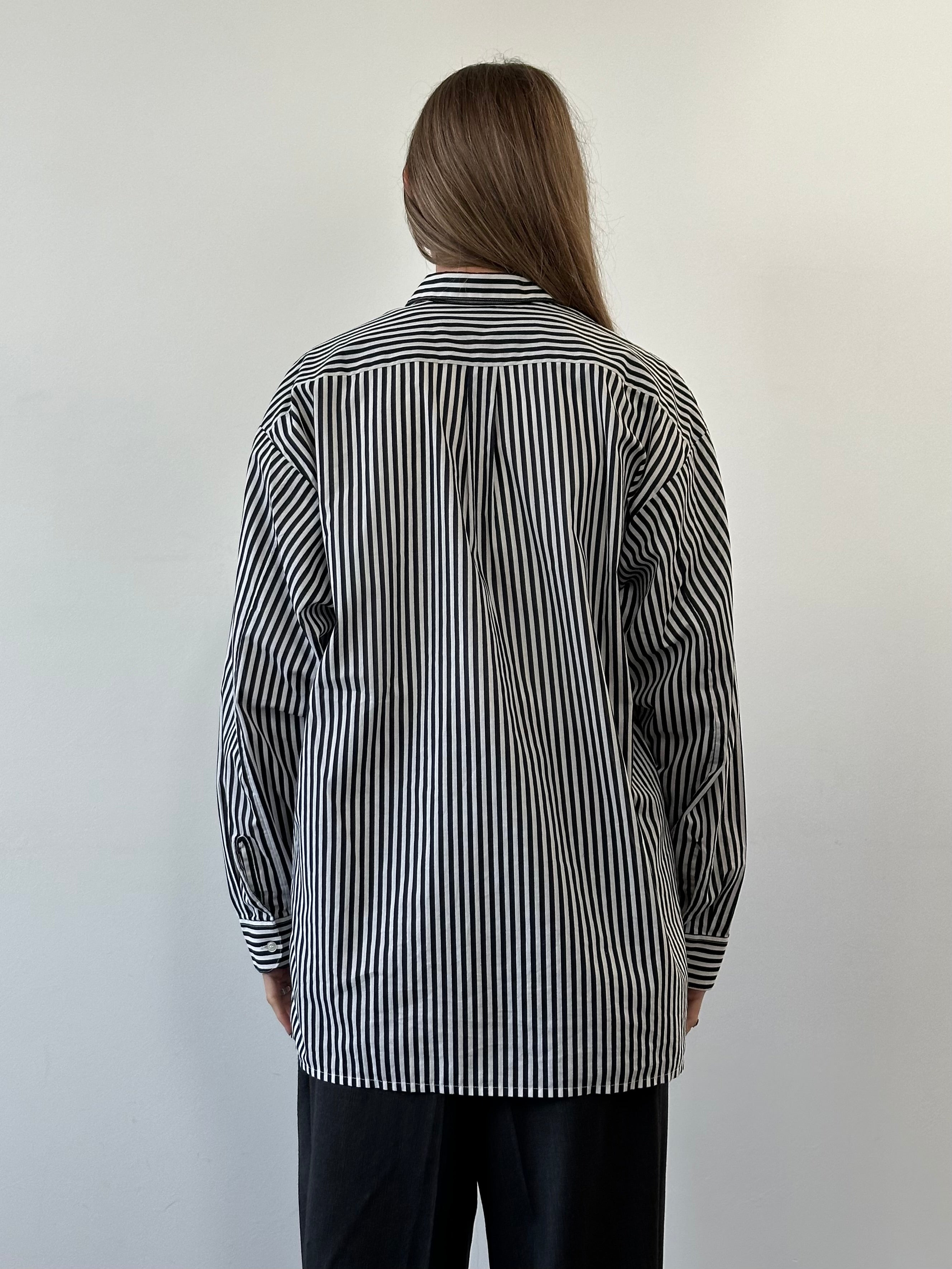 Vintage brand vintage stripe shirt in size XL, featuring classic horizontal red and white stripes, displayed flat on a neutral background.